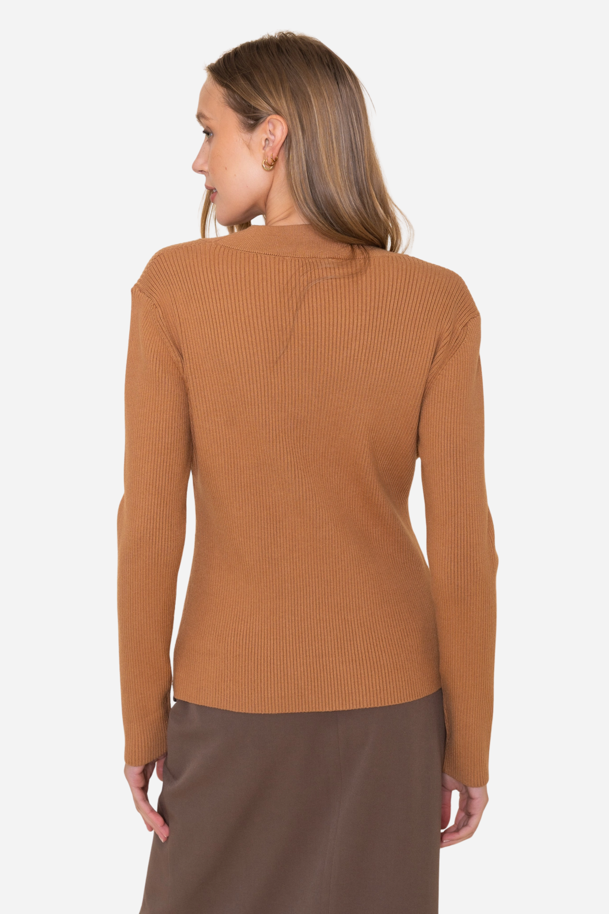 Camel-toned ribbed knit equestrian top featuring a deep scalloped neckline and two gold horsebit closures. Fitted long-sleeve cardigan-style top crafted from a poly/nylon blend, combining timeless elegance with refined equestrian detailing—perfect for fall and winter equestrian fashion.