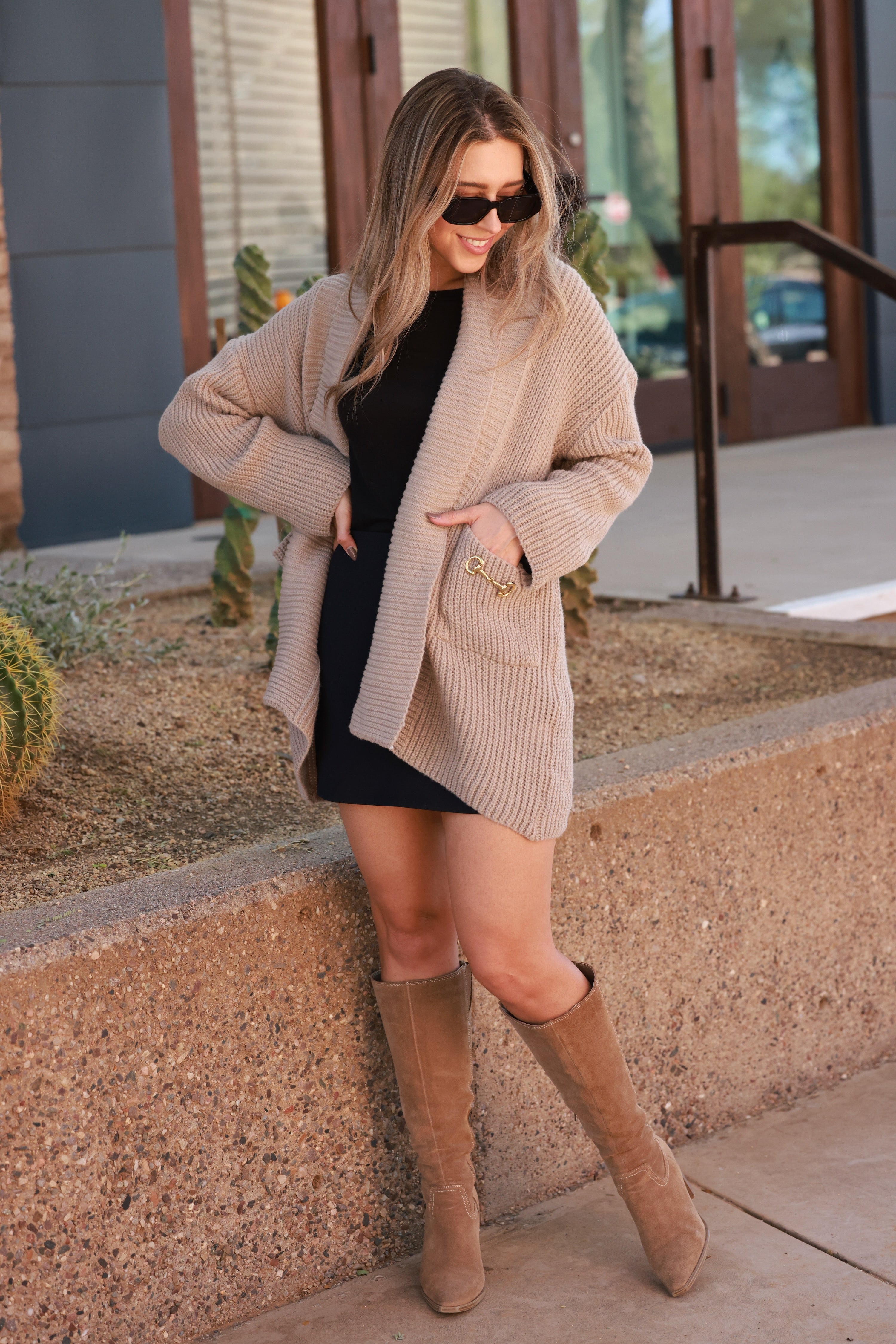 Elegant oversized equestrian cardigan in plush chunky knit with wide fold-over collar and front pockets adorned with gold horse bits. Cozy, luxurious open-front sweater inspired by classic horse girl style — the Aimee Bit Cardigan from Stylish Equestrian.
