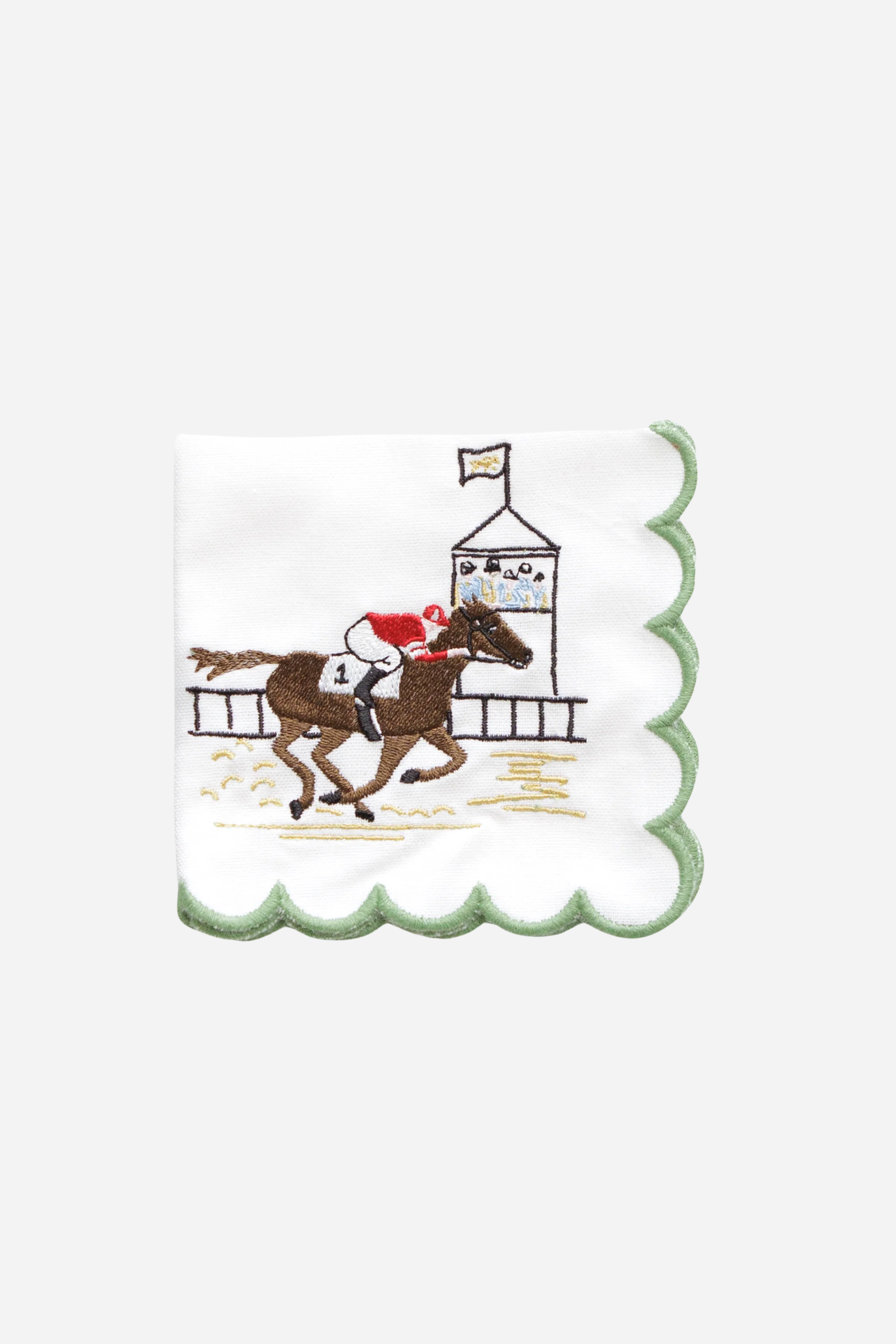 Pomegranate At The Finish Cocktail Napkin Set A toast to the thrill of the track! Our At the Finish Embroidered Cocktail Napkins bring race day excitement to every sip. Featuring a spirited racehorse and jockey charging past the finish line, these embroidered white cotton napkins with a green scalloped edge are a festive nod to the sport of kings—and the queens who throw a fabulous party.