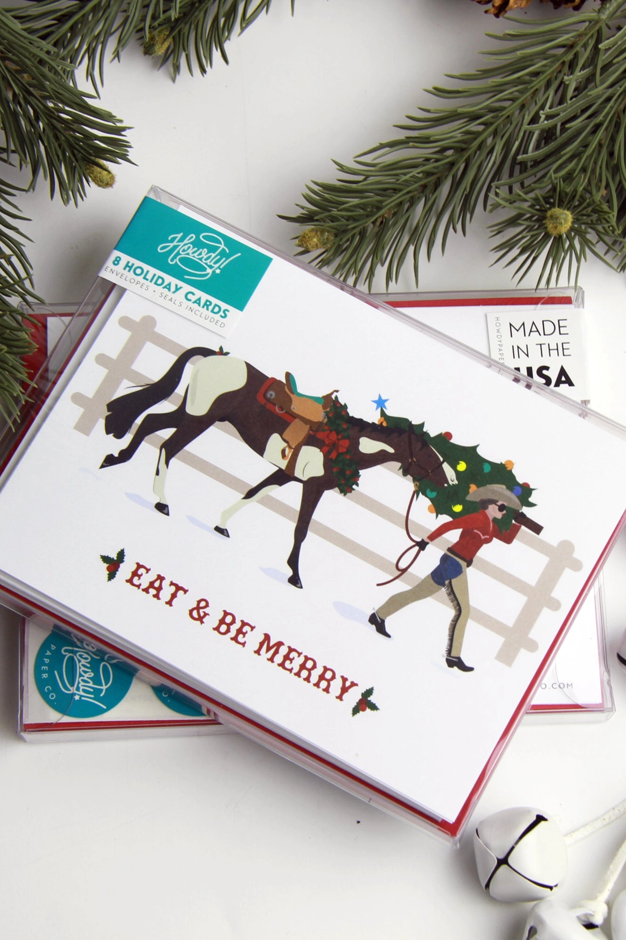 Be Merry Western Christmas card featuring a festive equestrian design printed on premium A2 14 pt unfinished card stock. Blank inside and packaged in a cellophane sleeve with matching envelope and seal. Perfect holiday greeting card for horse lovers and western style enthusiasts. Made in the USA. equestrian stationery, horse themed greeting cards, horse Christmas card, western holiday card, gifts for horse lovers, cowboy Christmas card, equestrian holiday stationery, horse lover card
