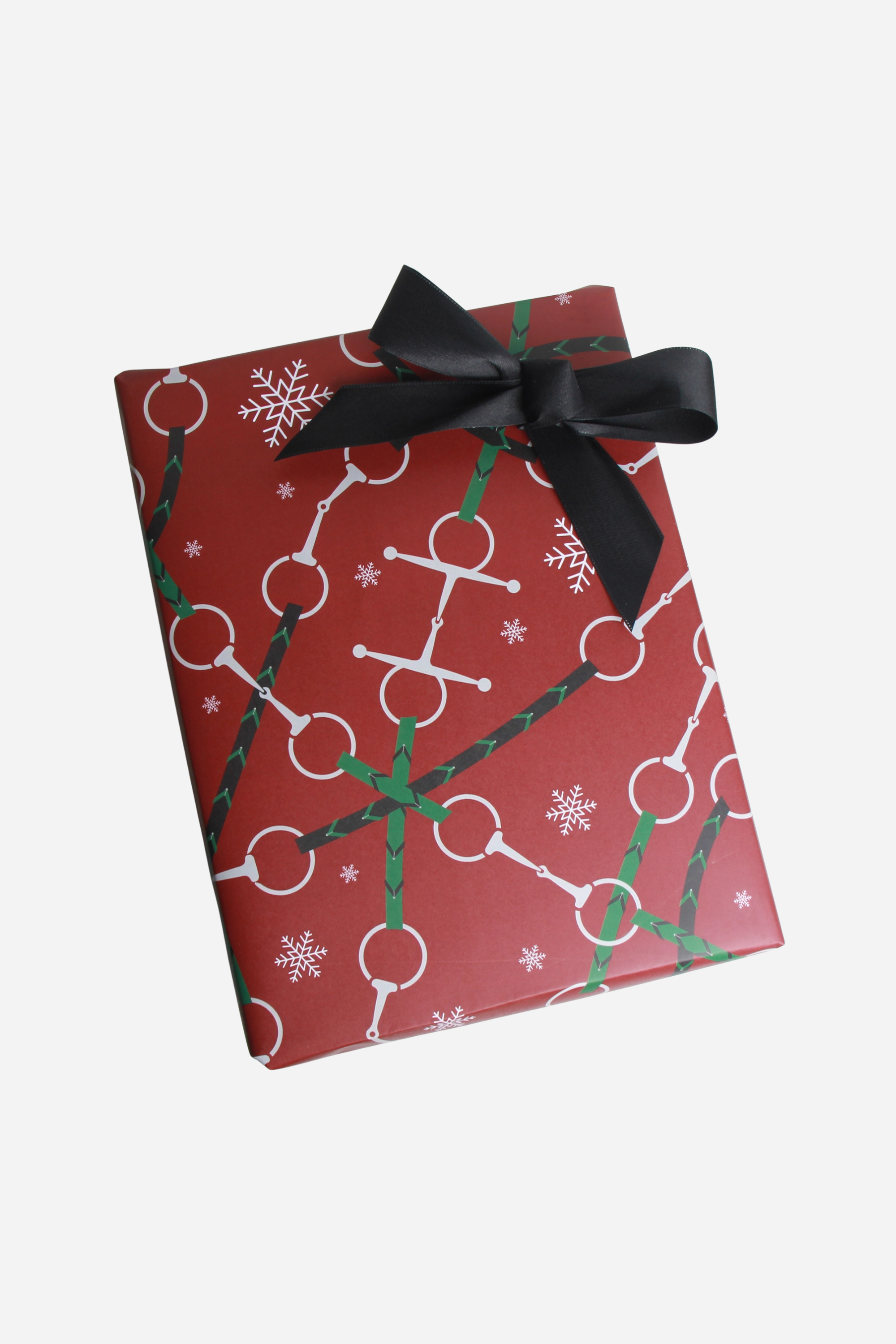 Set of three festive equestrian gift wrap sheets featuring a repeating pattern of horse bits and reins printed on luxurious, subtly textured high-quality paper. Perfect for holiday gifts, horse lovers, and equestrian-inspired packaging. Made in the USA. equestrian gift wrapping paper, horse themed wrapping paper, horse bit gift wrap sheets, holiday equestrian wrapping paper, luxury horse wrapping paper, equestrian stationery, elegant horse gift wrap, horse lover gift wrap, premium horse gift wrap