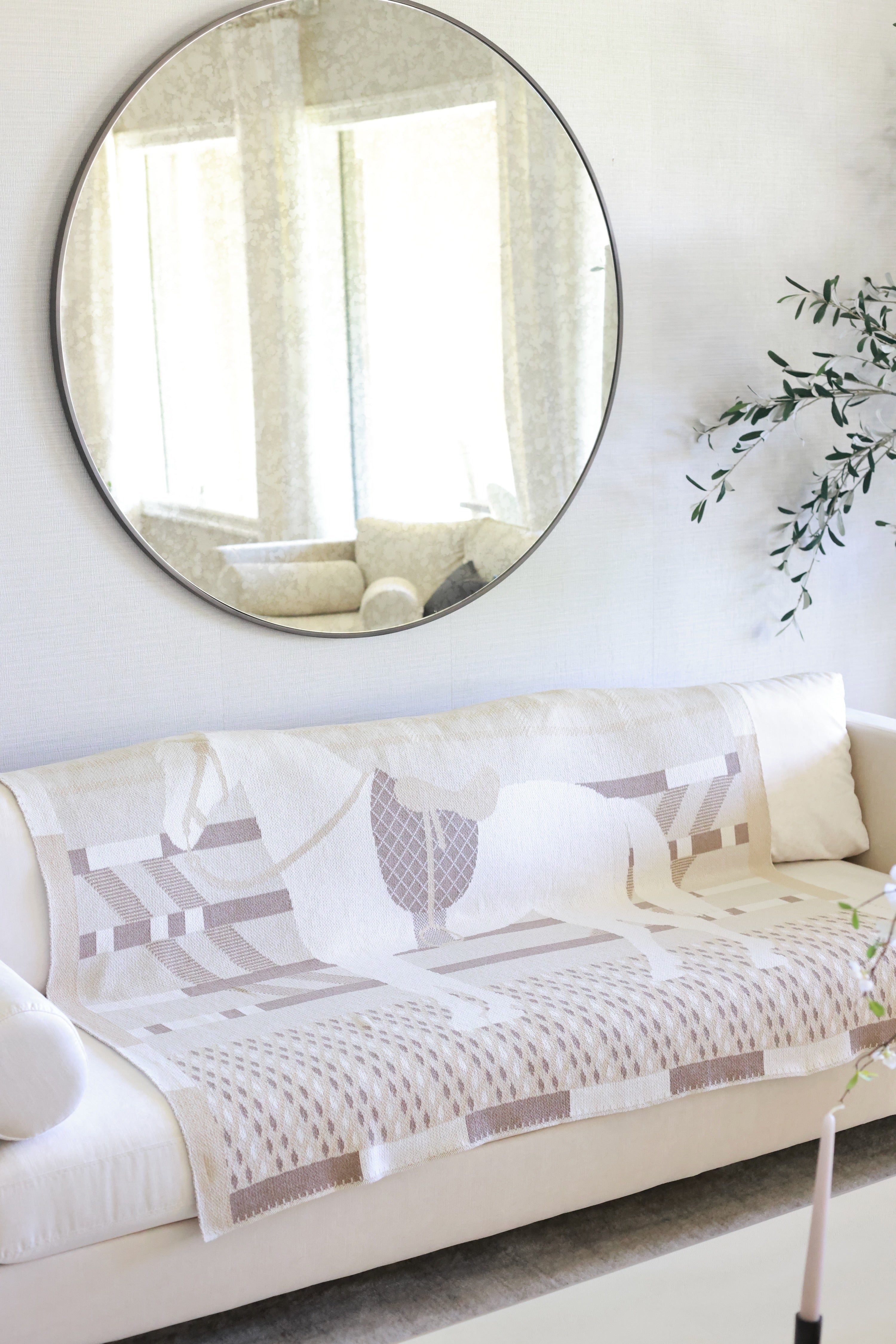 Cheval Stripes Throw by Stylish Equestrian — a soft, luxurious cotton-blend blanket featuring an all-over equestrian-inspired knit pattern in warm neutral tones. Perfect cozy accent for your home after a long day at the barn. Measures 60” x 50”, machine washable, and made in the USA. equestrian home decor and interior design, horse themed blanket, horse bit throw, equestrian home furnishing, luxury equestrian throw, horse lover gift, neutral knit blanket, elegant horse home accessory