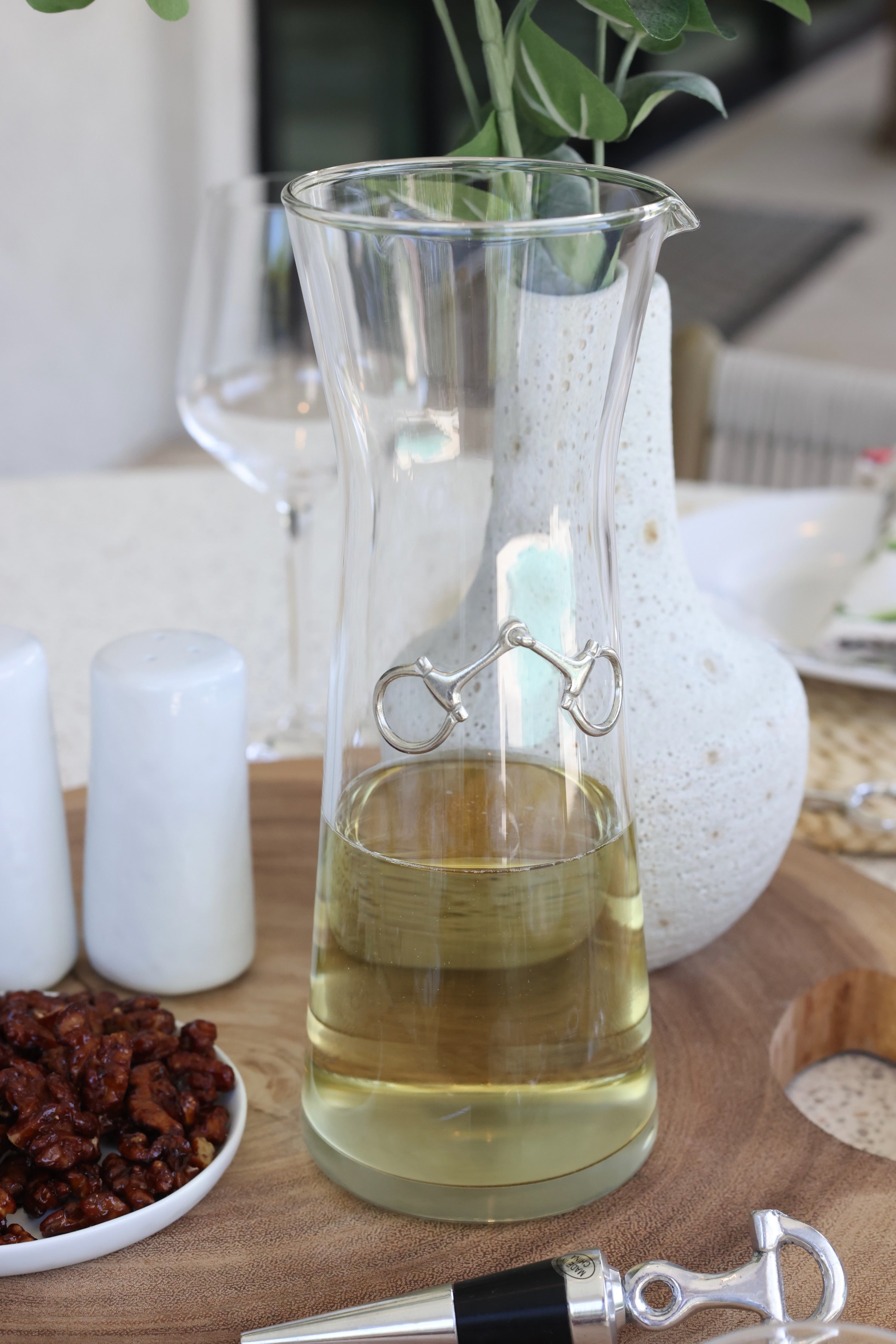 arthur court stylish equestrian dawson horse bit carafe Dawson Carafe by Arthur Court featuring a 28 oz clear glass body accented with a crafted pewter horse bit. A sophisticated equestrian-inspired carafe designed to enhance beverages and elevate any table setting.