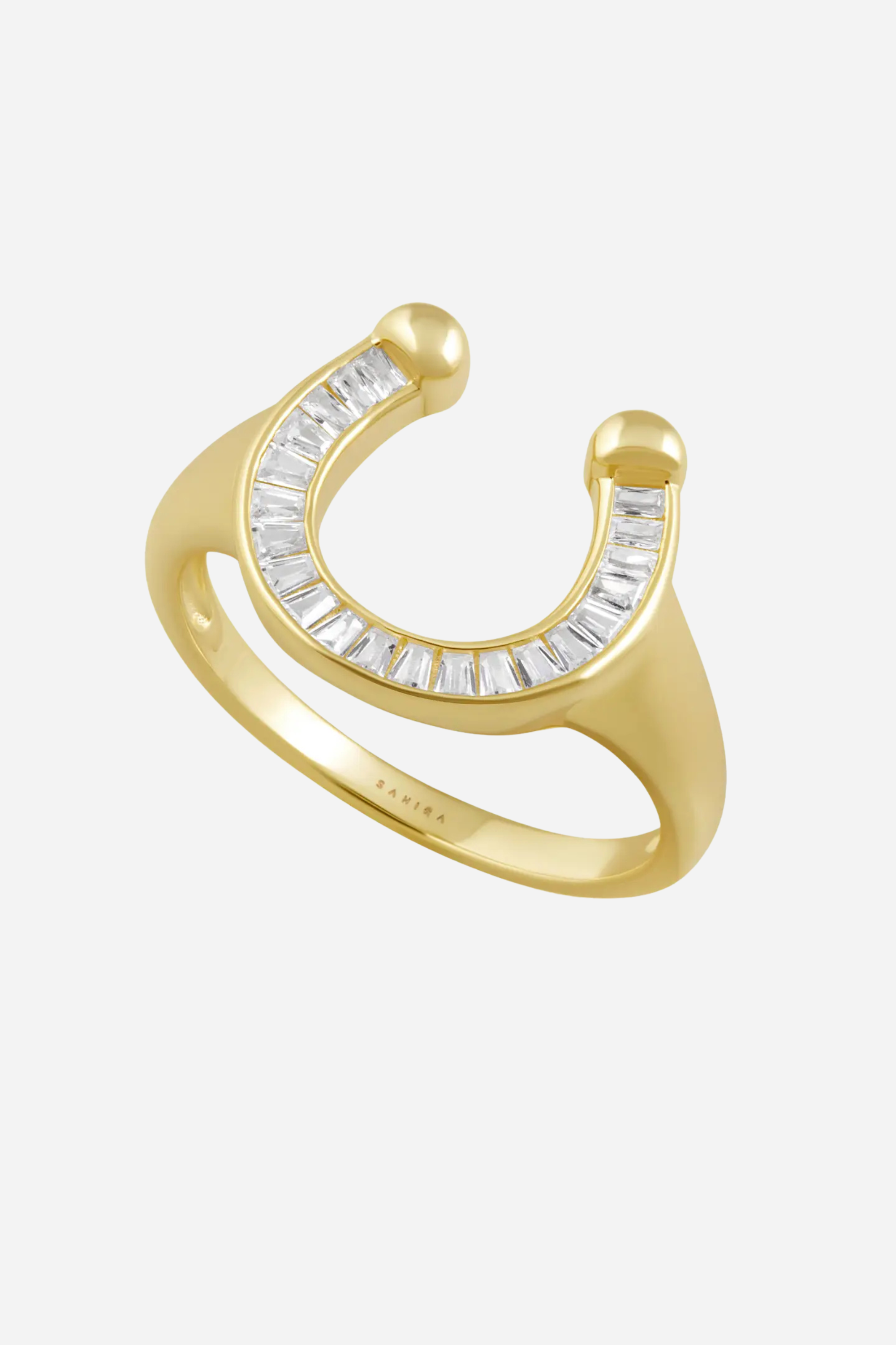 Gold ring with diamond accents on a white background