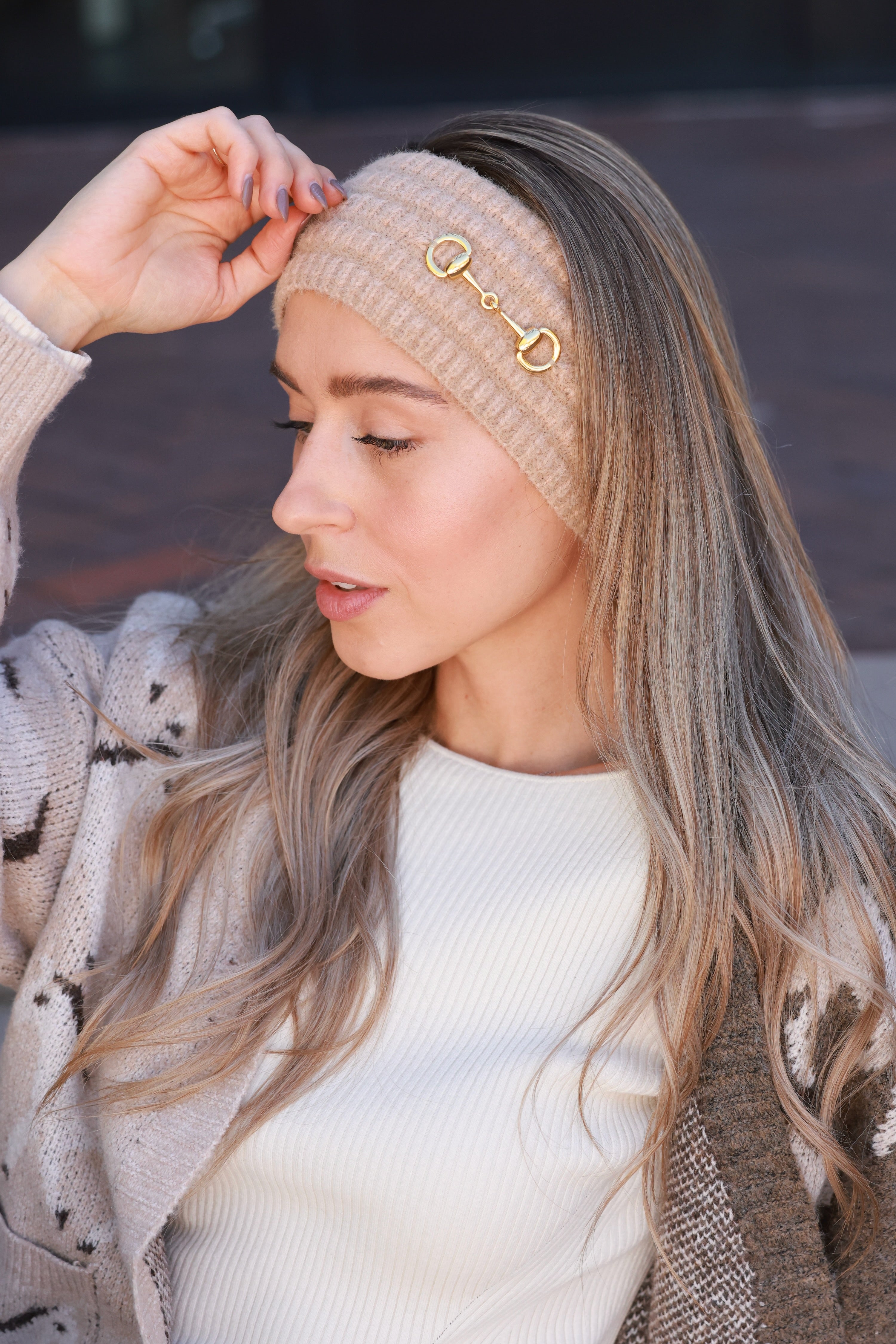 Taupe Elsie Knit Headband crafted from soft, stretchy knit with a gold bit accent. Cozy equestrian cold-weather accessory designed for comfort and style — perfect for barn mornings, trail rides, or everyday wear.