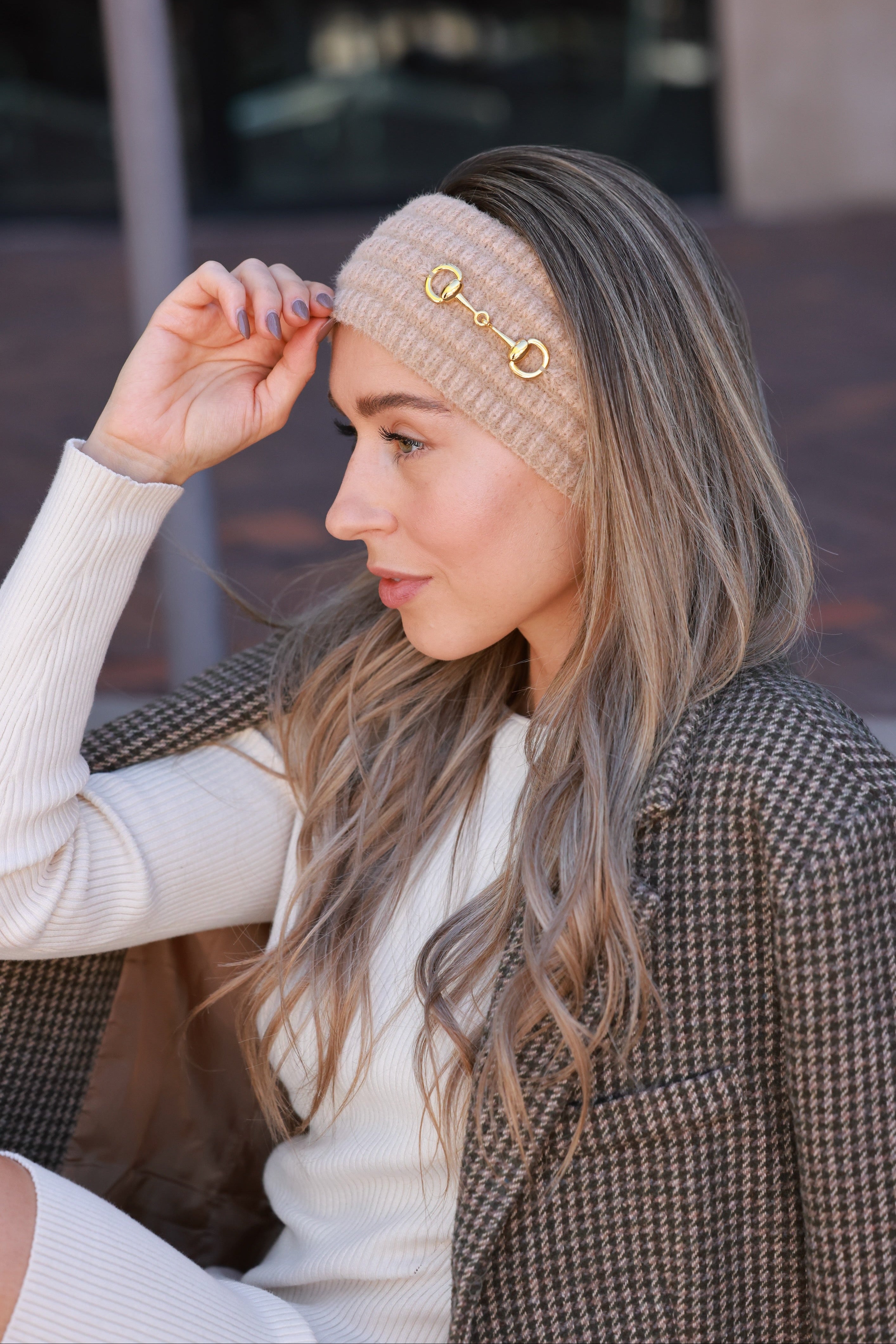 Taupe Elsie Knit Headband crafted from soft, stretchy knit with a gold bit accent. Cozy equestrian cold-weather accessory designed for comfort and style — perfect for barn mornings, trail rides, or everyday wear.