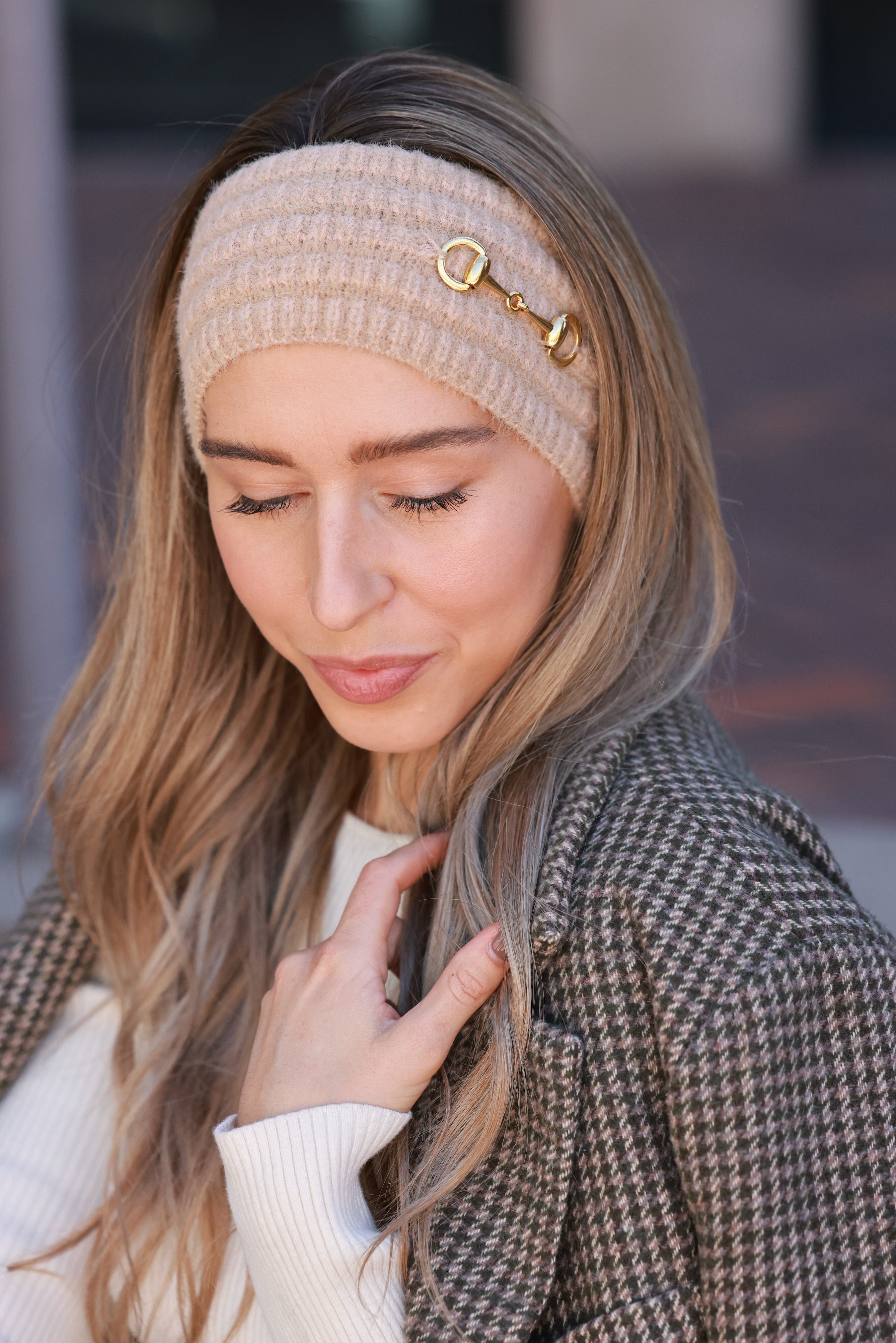 Taupe Elsie Knit Headband crafted from soft, stretchy knit with a gold bit accent. Cozy equestrian cold-weather accessory designed for comfort and style — perfect for barn mornings, trail rides, or everyday wear.