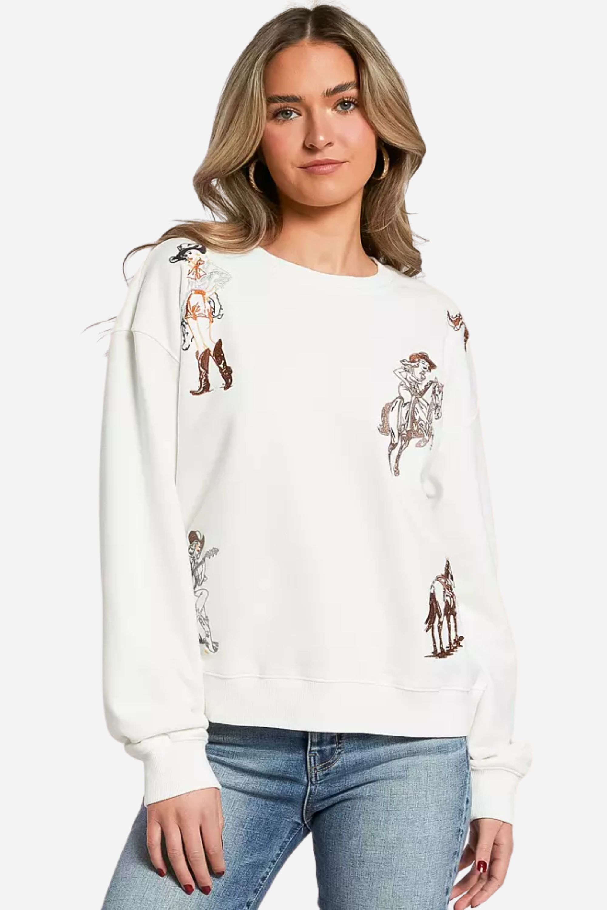 Woman wearing a white embroidered western cowgirl sweatshirt featuring horse and cowgirl-themed illustrations. This cozy equestrian clothing piece blends comfort and western riding style, perfect horse girl apparel with detailed embroidery for everyday wear.