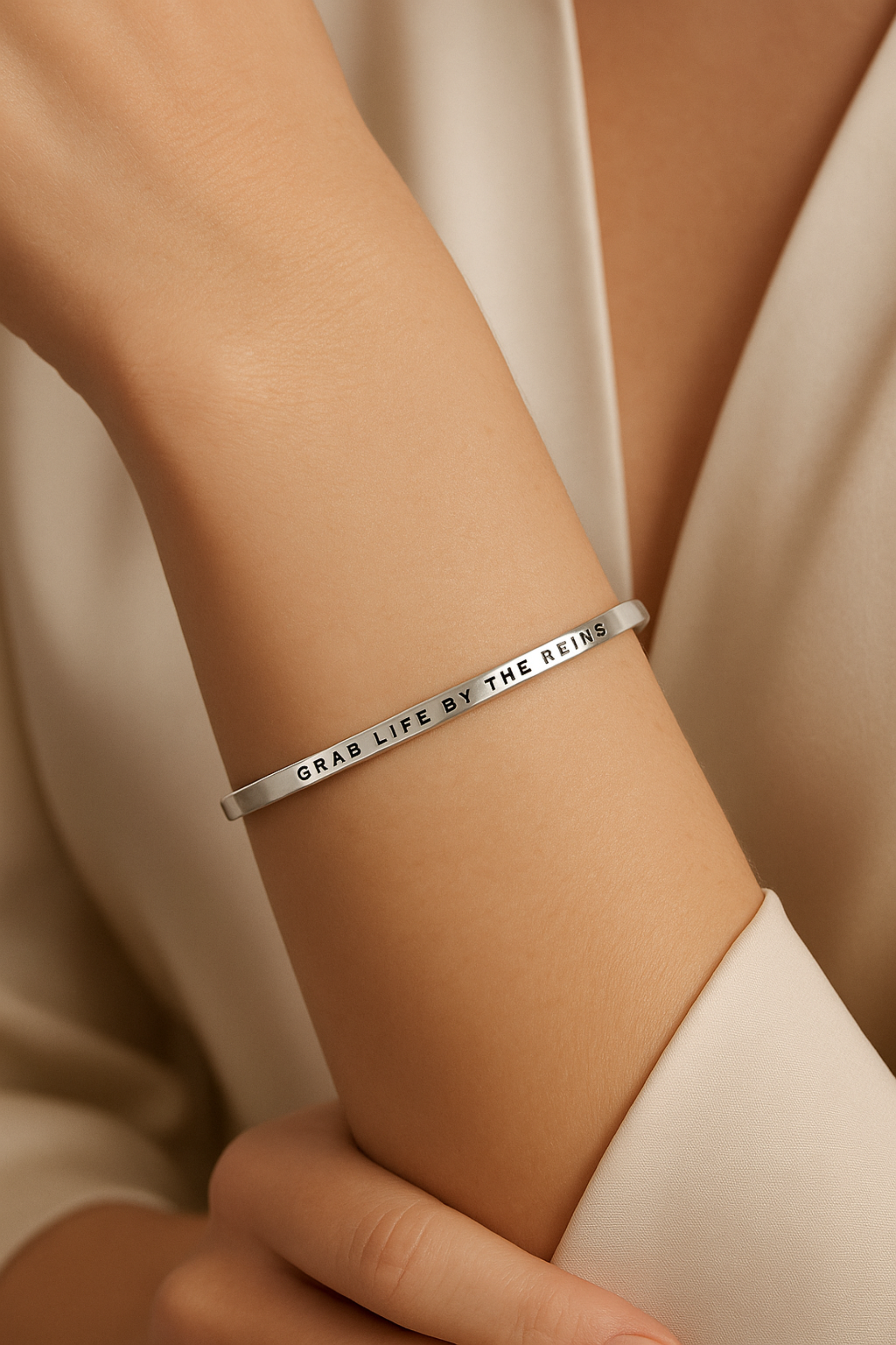 Grab Life By The Reins” bangle bracelet in silver or gold, featuring a sleek stainless steel design with an inspirational equestrian theme. Adjustable, tarnish-resistant, and perfect for horse lovers or as a motivational gift.