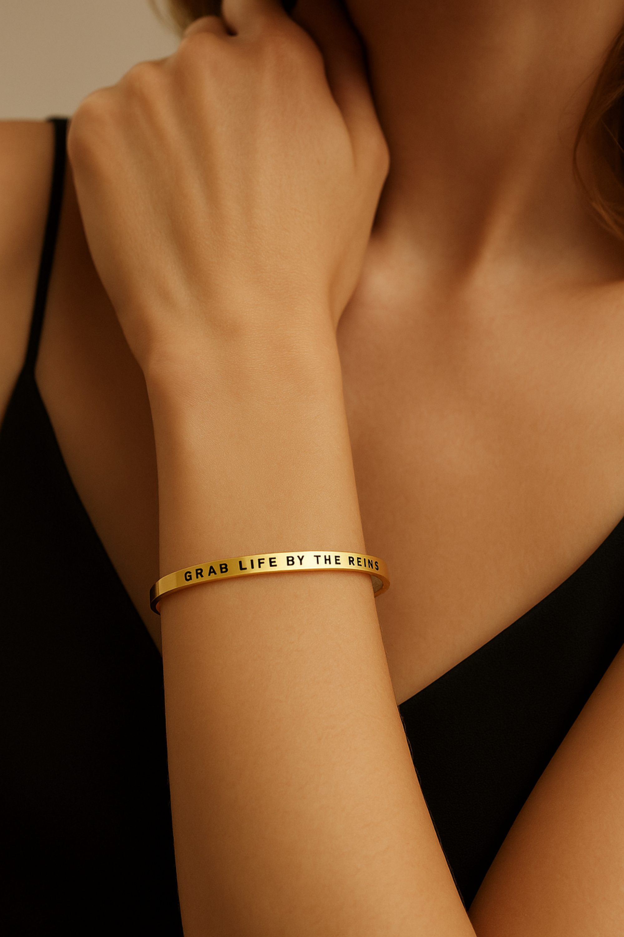 Grab Life By The Reins” bangle bracelet in silver or gold, featuring a sleek stainless steel design with an inspirational equestrian theme. Adjustable, tarnish-resistant, and perfect for horse lovers or as a motivational gift.