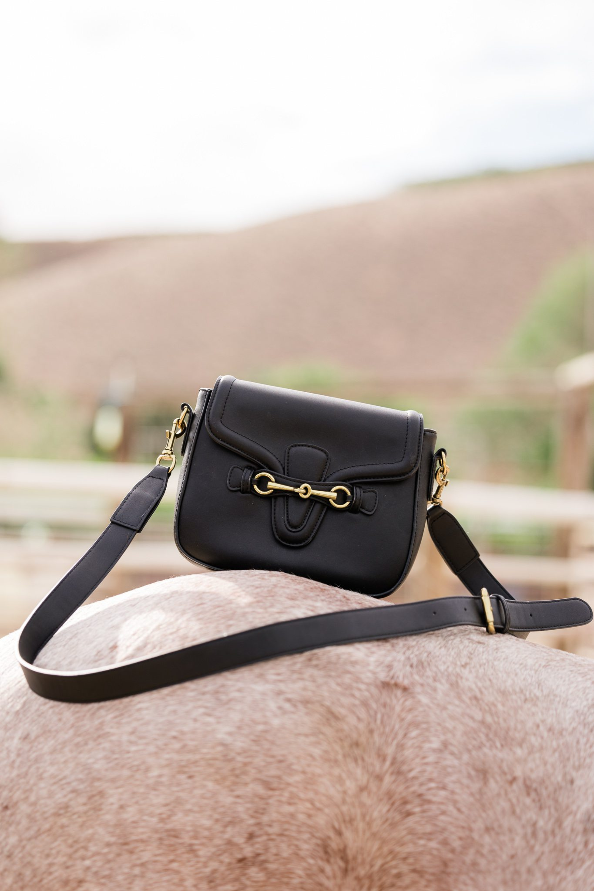Front close-up of luxury black leather crossbody with equestrian horse bit design – Stylish Equestrian