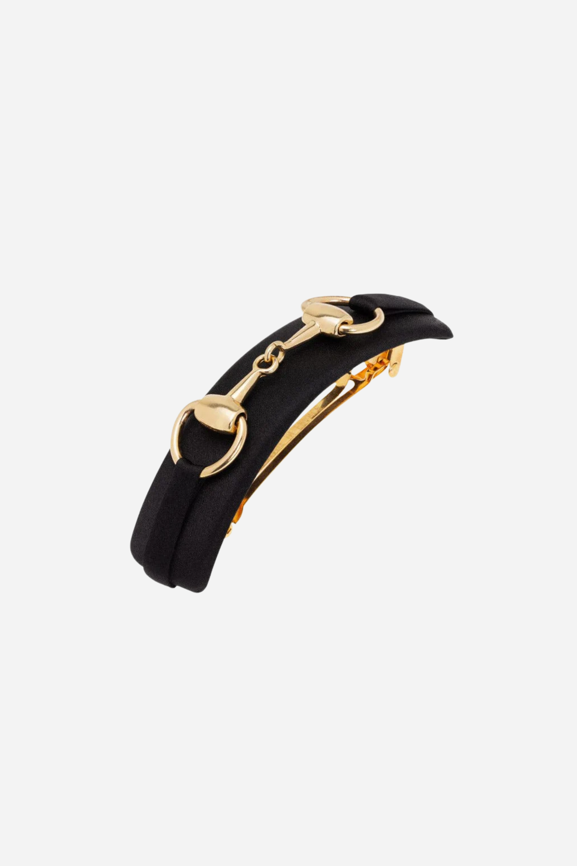 Black Hattie Bit Silk Barrette handcrafted in 100% silk charmeuse, featuring a large gold snaffle bit detail and sturdy clasp for thick hair. Elegant equestrian-inspired accessory that adds everyday chic and timeless sophistication to any hairstyle.