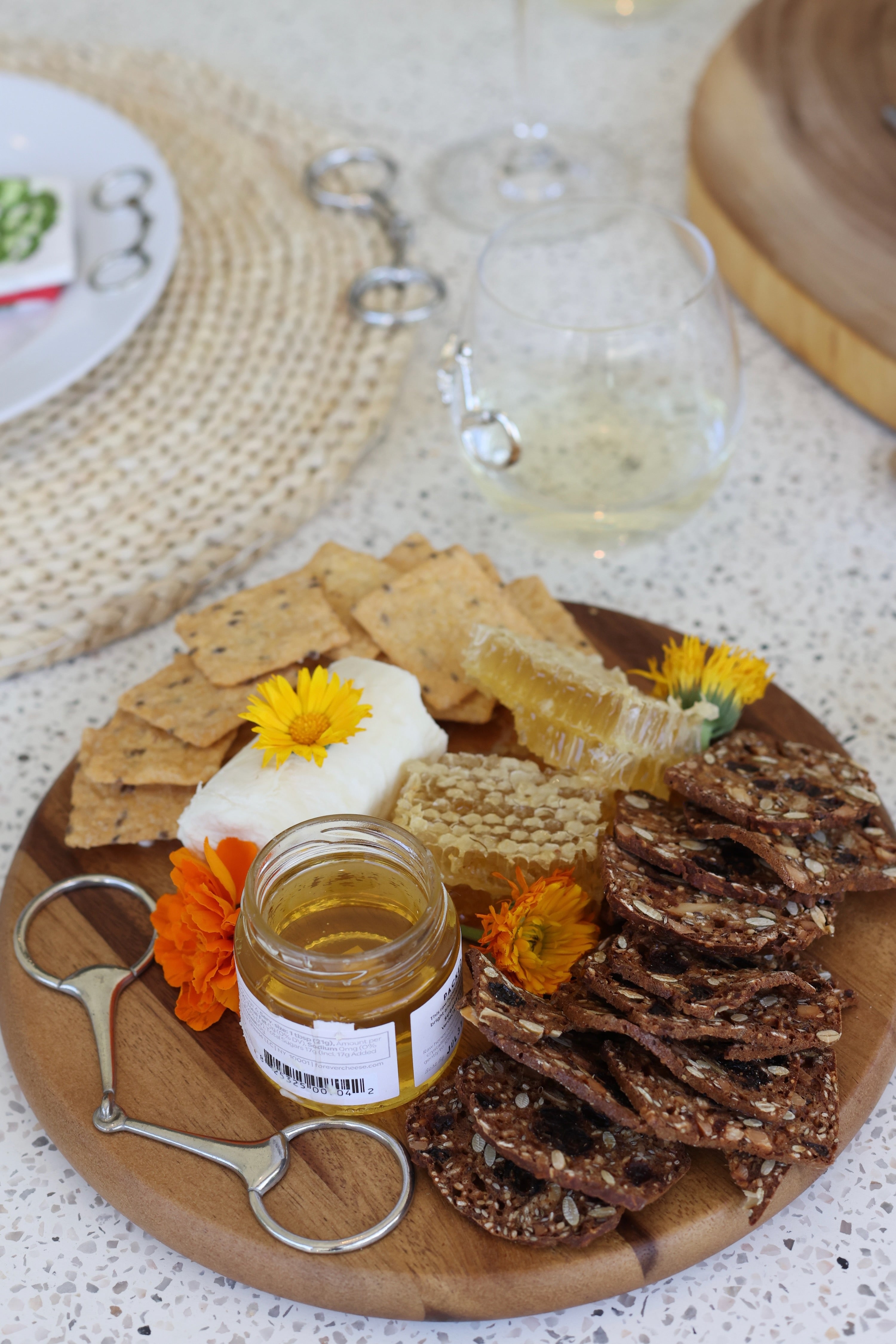 arthur court stylish equestrian henry wooden serving board horse bit Henry Bit Serving Board by Arthur Court featuring a round 10-inch acacia wood board accented with a pewter horse bit detail. A refined equestrian-inspired serving piece perfect for charcuterie, entertaining, or gifting.