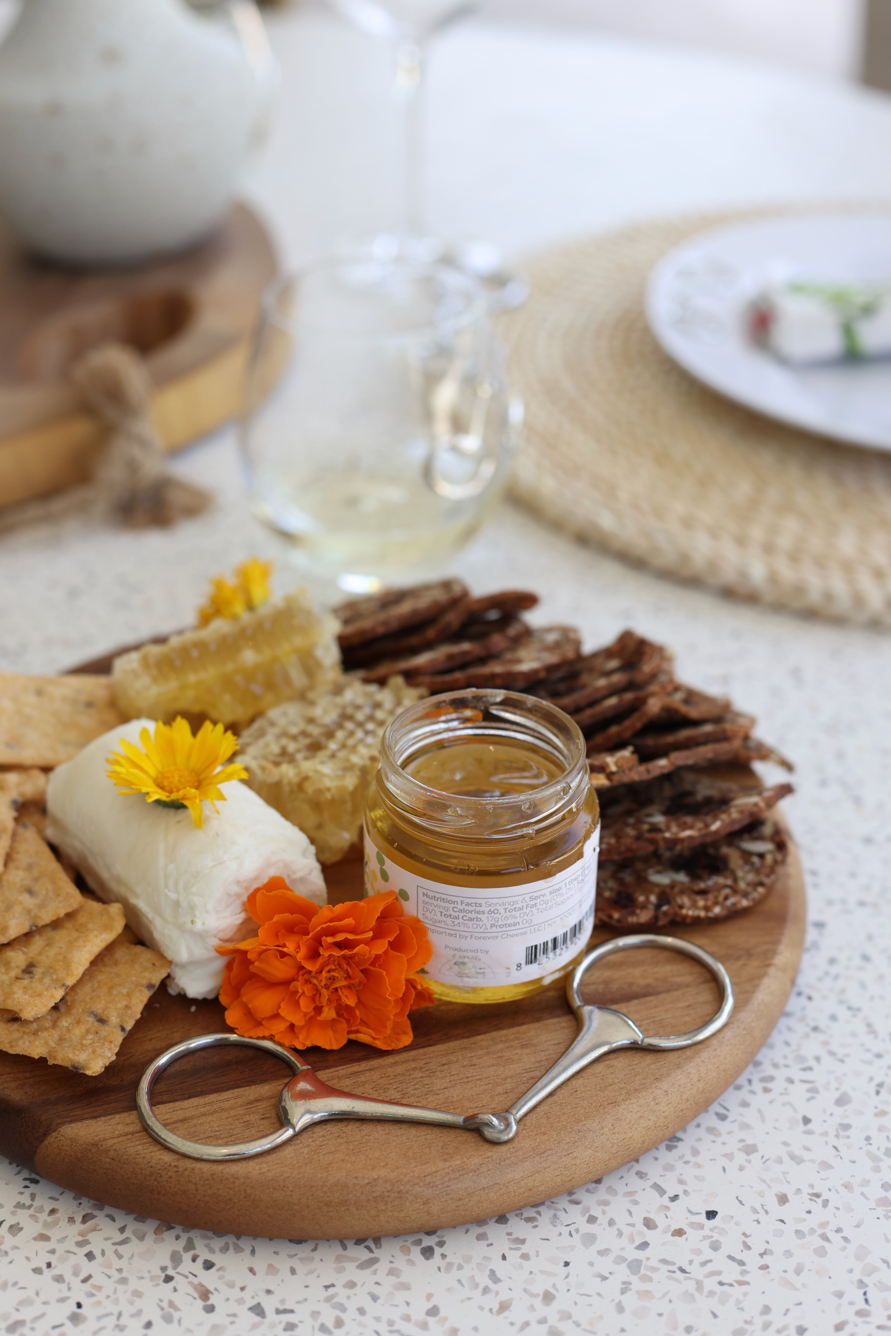 arthur court stylish equestrian henry wooden serving board horse bit Henry Bit Serving Board by Arthur Court featuring a round 10-inch acacia wood board accented with a pewter horse bit detail. A refined equestrian-inspired serving piece perfect for charcuterie, entertaining, or gifting.