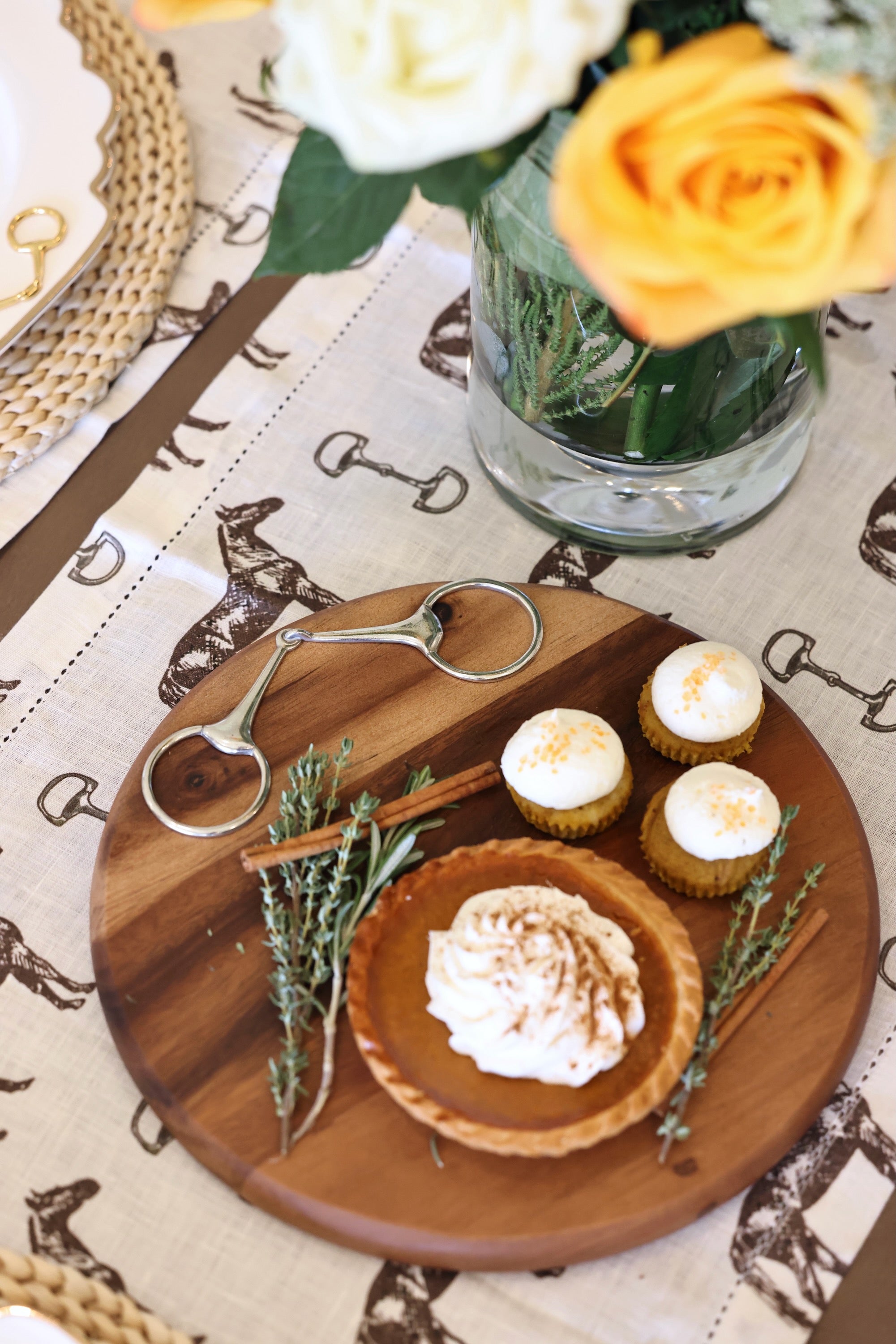 arthur court stylish equestrian wooden horse bit round serving board Henry Bit Serving Board by Arthur Court featuring a round 10-inch acacia wood board accented with a pewter horse bit detail. A refined equestrian-inspired serving piece perfect for charcuterie, entertaining, or gifting.