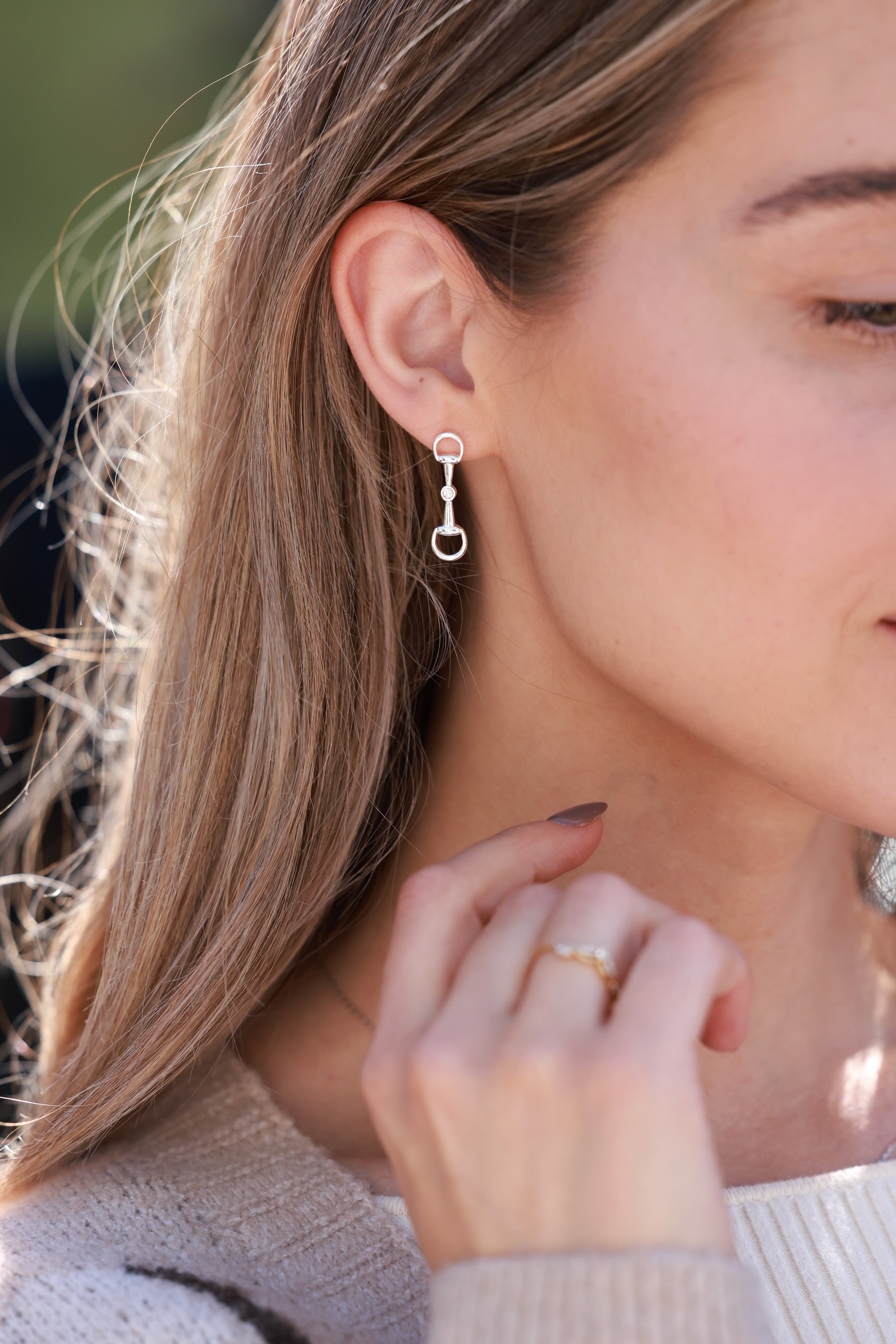 Silver equestrian bit drop earrings with crystal accents, lightweight horse girl jewelry, dainty CZ stud earrings, elegant gift for equestrian lovers.