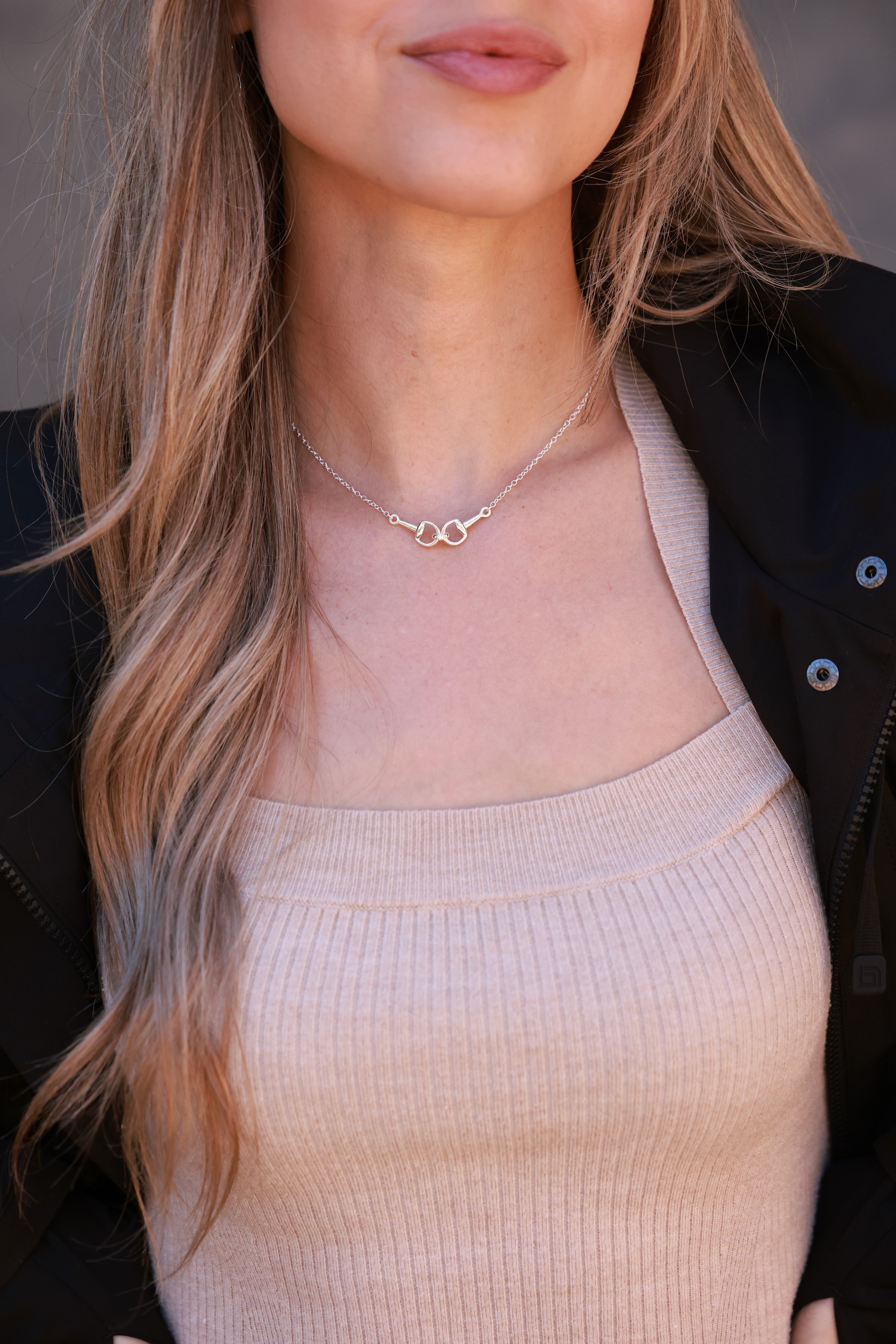Silver necklace on a person wearing a beige top -equestrian inspired jewelry, horse girl accessory, horseshoe pendant necklace, dainty equestrian jewelry, small gifts for horse lovers