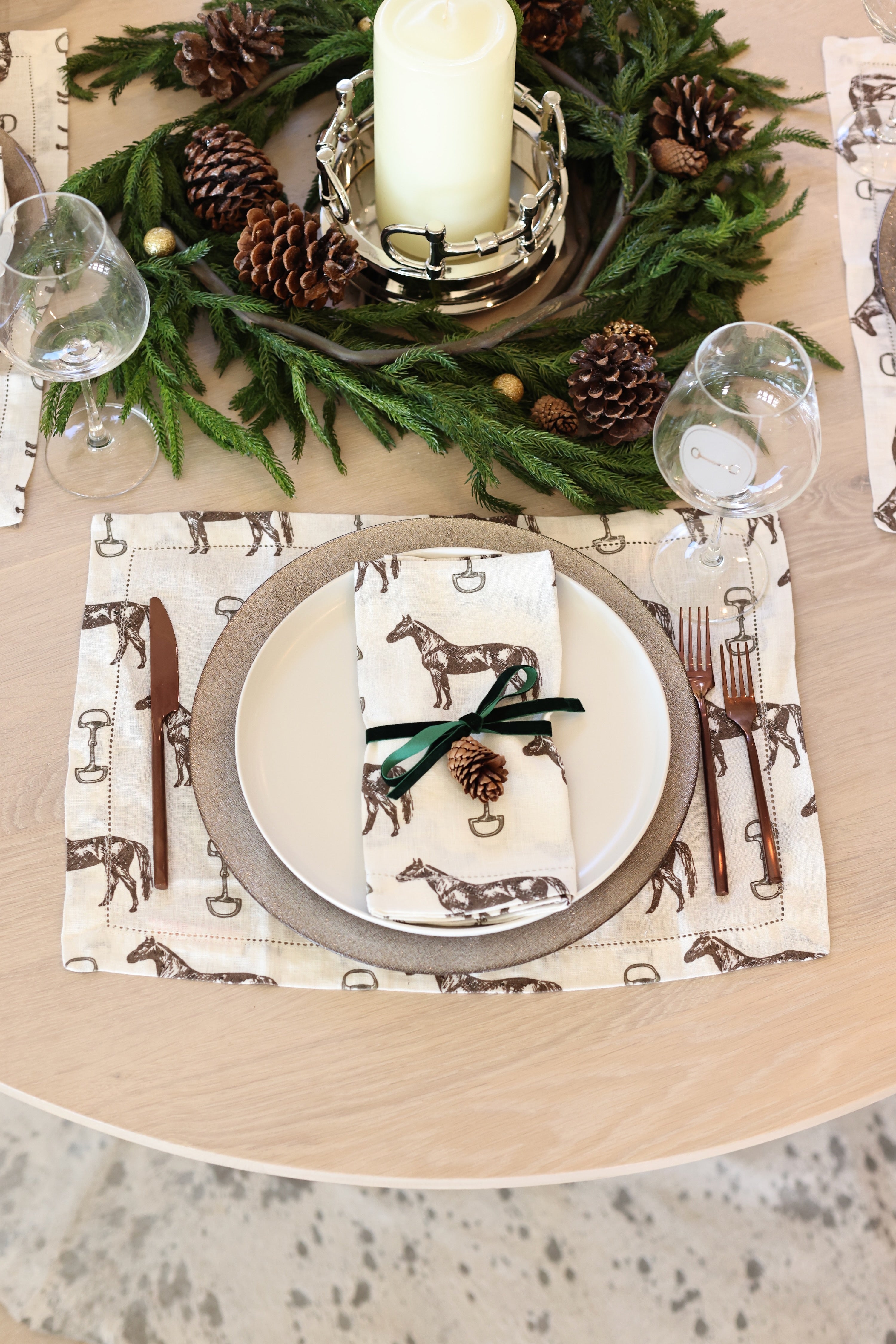Horse & Snaffle Linen Placemat Set featuring a hand-sketched design of horses and snaffle bits on white linen with a stitched border. Set of four elegant 13x19" placemats perfect for equestrian-inspired table settings.