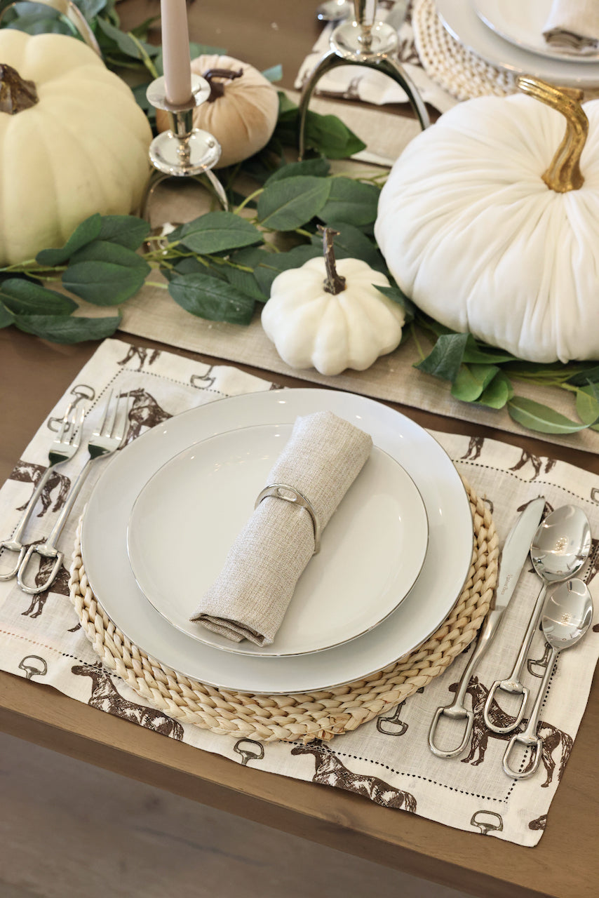 pomegranate inc stylish equestrian horse and snaffle linen placemat set Horse & Snaffle Linen Placemat Set featuring a hand-sketched design of horses and snaffle bits on white linen with a stitched border. Set of four elegant 13x19" placemats perfect for equestrian-inspired table settings.