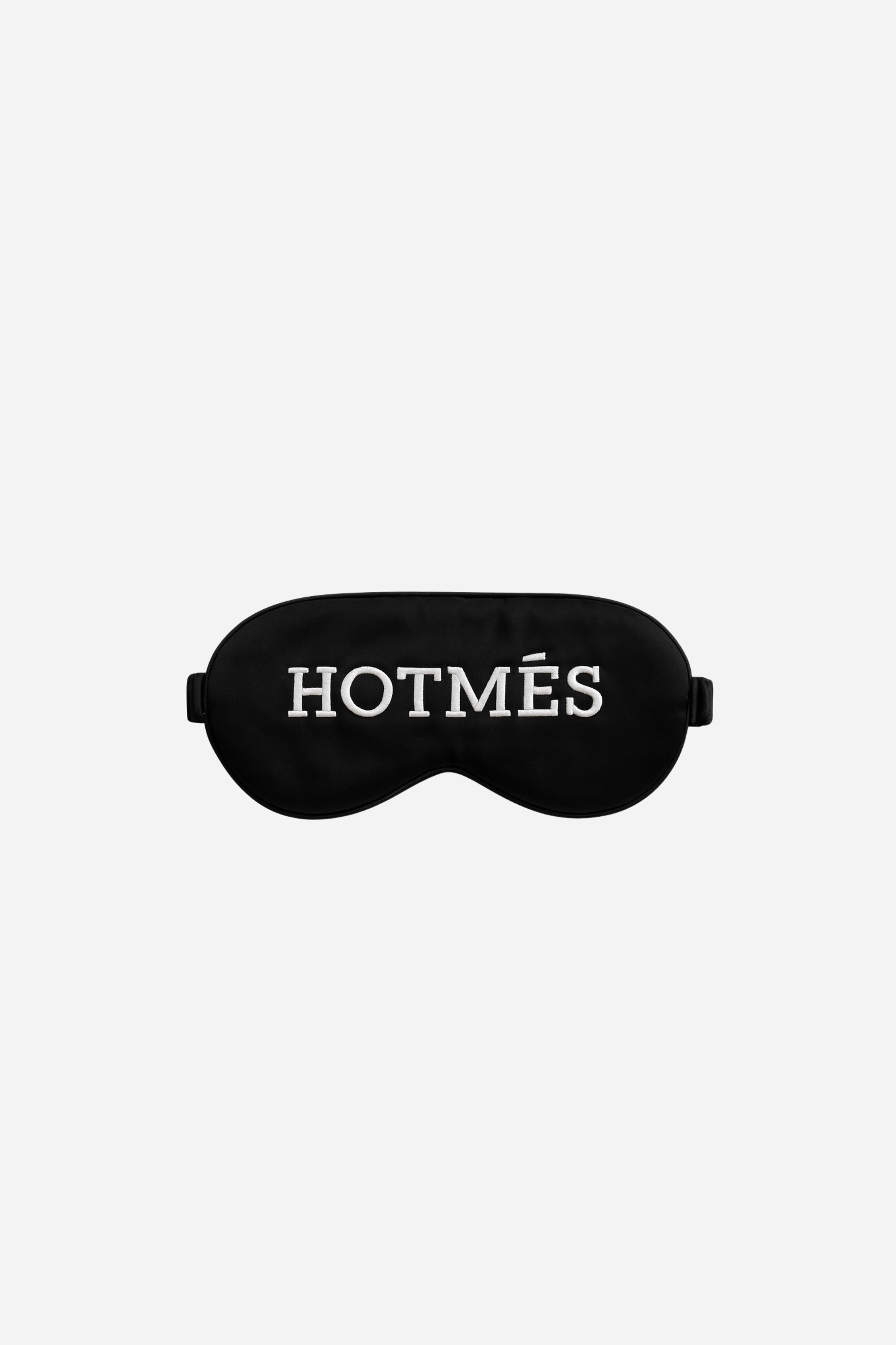Hotmés Silk Sleep Mask made from 100% silk with front embroidery and elastic strap. Luxurious, comfortable, equestrian-inspired sleep accessory.