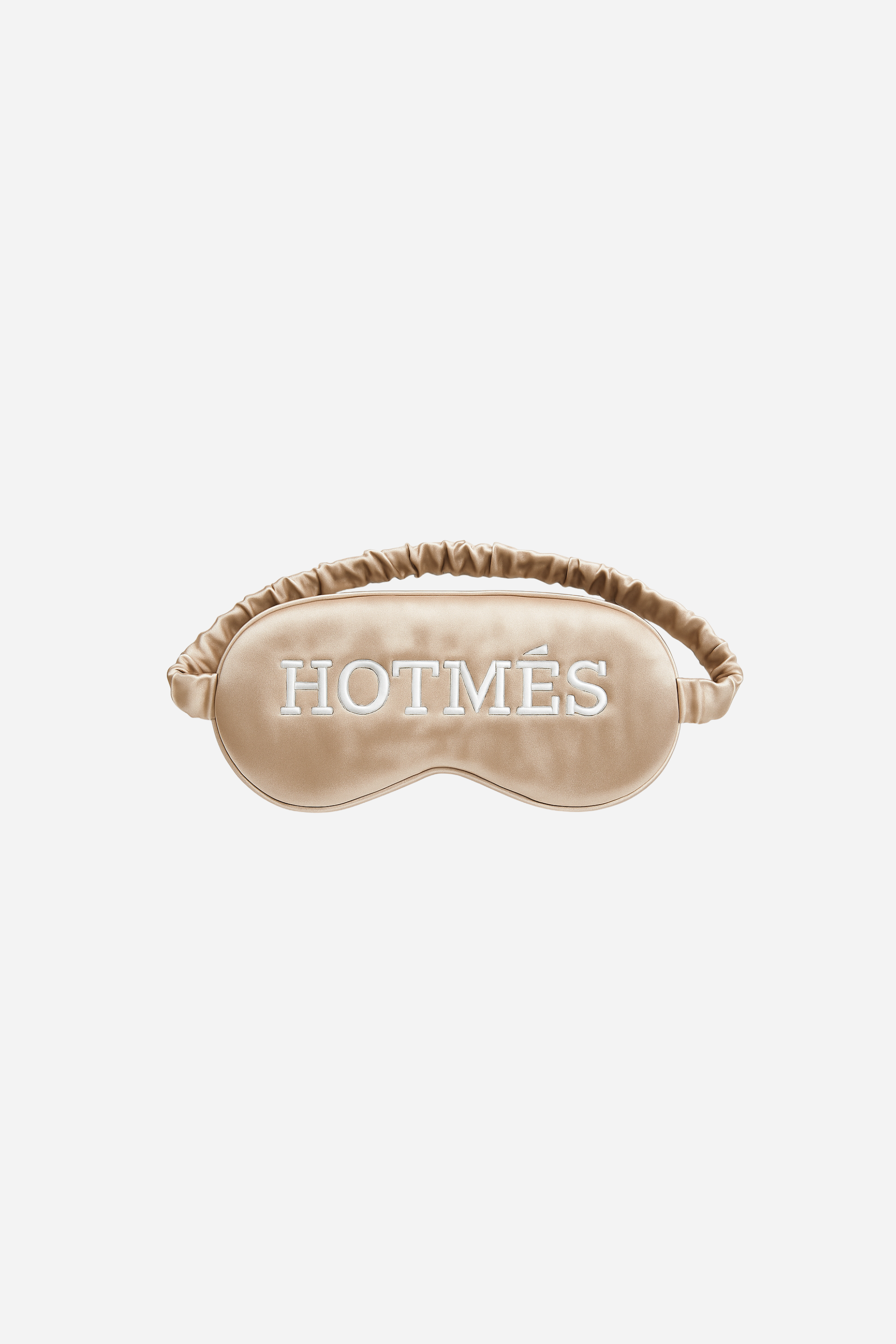 Hotmés Silk Sleep Mask made from 100% silk with front embroidery and elastic strap. Luxurious, comfortable, equestrian-inspired sleep accessory.