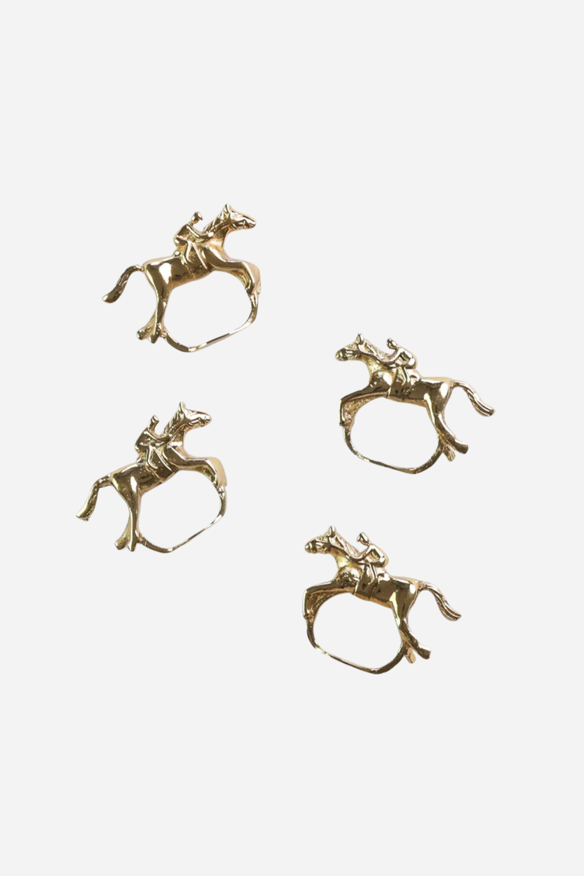 Pomegranate Jockey Napkin Ring Set - Gold Bring a touch of luxury to your table with the Gold Jockey Napkin Rings. This set of four features a stunning horse & jockey design that shines at every gathering. Ideal for formal dinners or casual brunches, these napkin rings are the perfect accessory to elevate your dining decor.