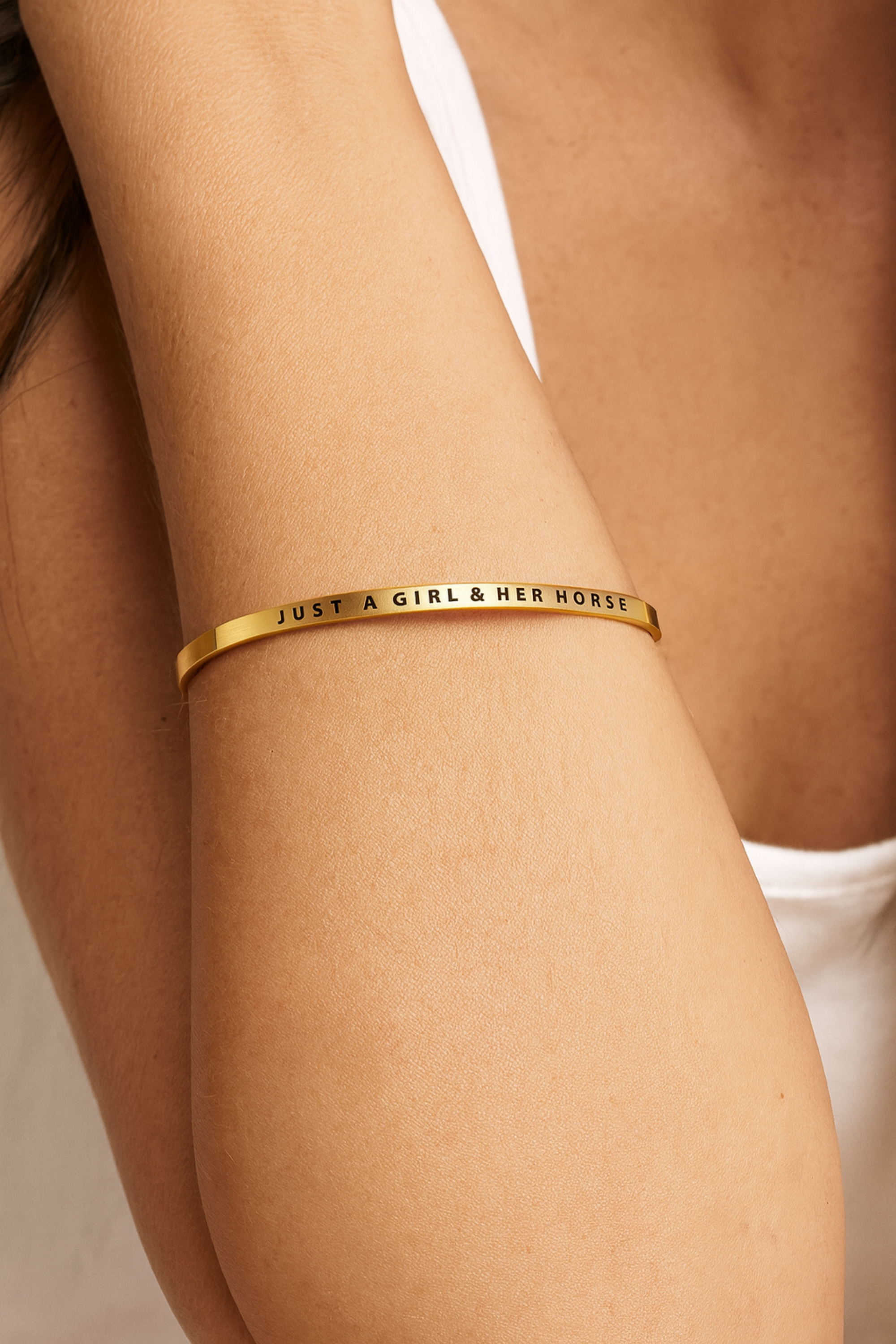 Just A Girl & Her Horse Bangle — adjustable stainless steel equestrian bracelet in gold or silver. Features engraved design celebrating the bond between a girl and her horse. Stylish Equestrian exclusive, lead-free, tarnish-resistant, and 18k gold-dipped on gold version.