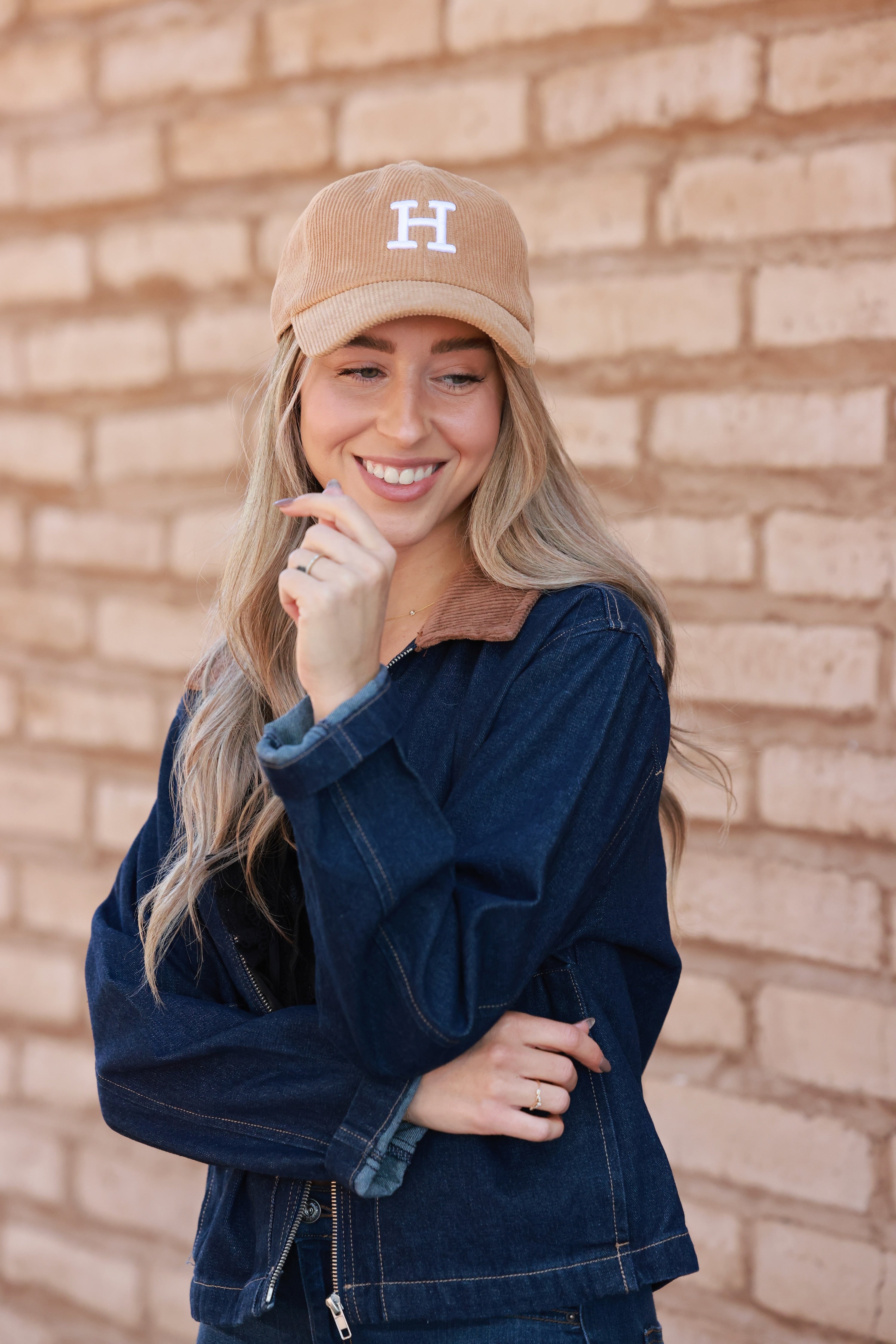 Camel Le Horse Corduroy Cap featuring trendy embroidered ‘H’ front and side Le Horse detail. Unstructured, low-profile six-panel design with pre-curved visor and adjustable strap for a comfortable fit.