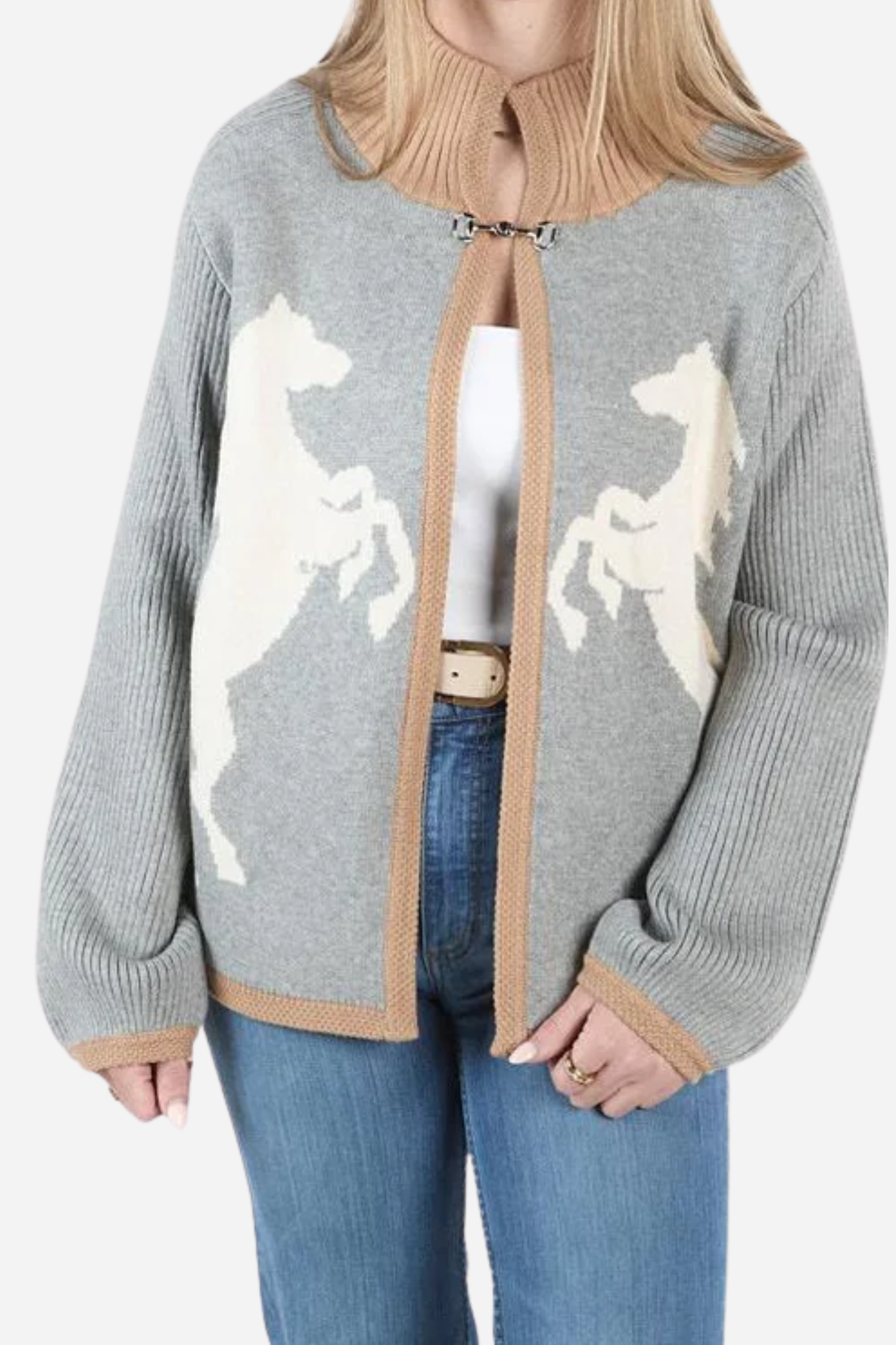 A cream-colored intarsia-knit cardigan featuring rearing horse motifs, a functional bit toggle closure at the chest, a ribbed stand collar, ribbed sleeves, and contrasting camel trim. The equestrian-inspired Lily Horse & Bit Cardigan has a structured, cozy design and a timeless, elevated look.