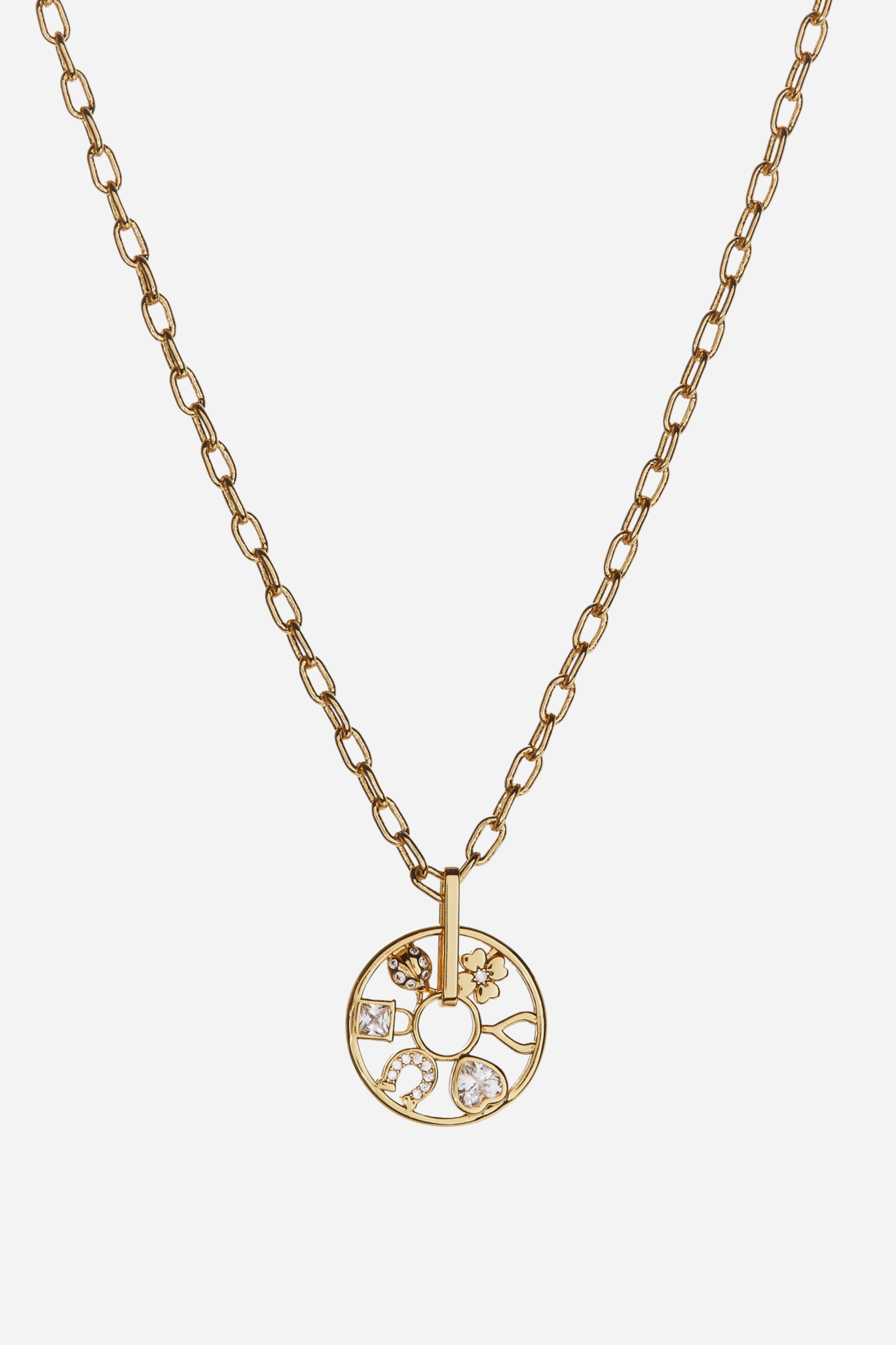 Dainty gold-plated Love & Luck wheel necklace with crystal details and adjustable chain, featuring whimsical lucky symbols inspired by equestrian charm jewelry.
These Love and Luck Wheel Charm Necklace has six crystal-accented lucky symbols: a four-leaf clover, a ladybug, a lock, a wishbone, a horseshoe and a sparkling heart, all on a wheel-shaped charm that spins around an adjustable-length necklace chain.