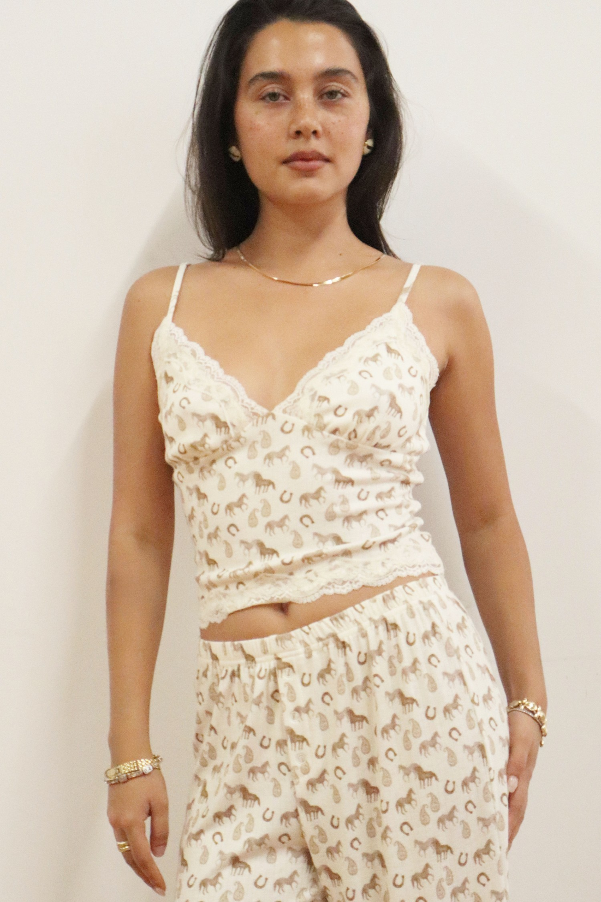 Lucky Charm horse print pajama set in pale cream with lace trim cami top, adjustable straps, and elastic waist pants.