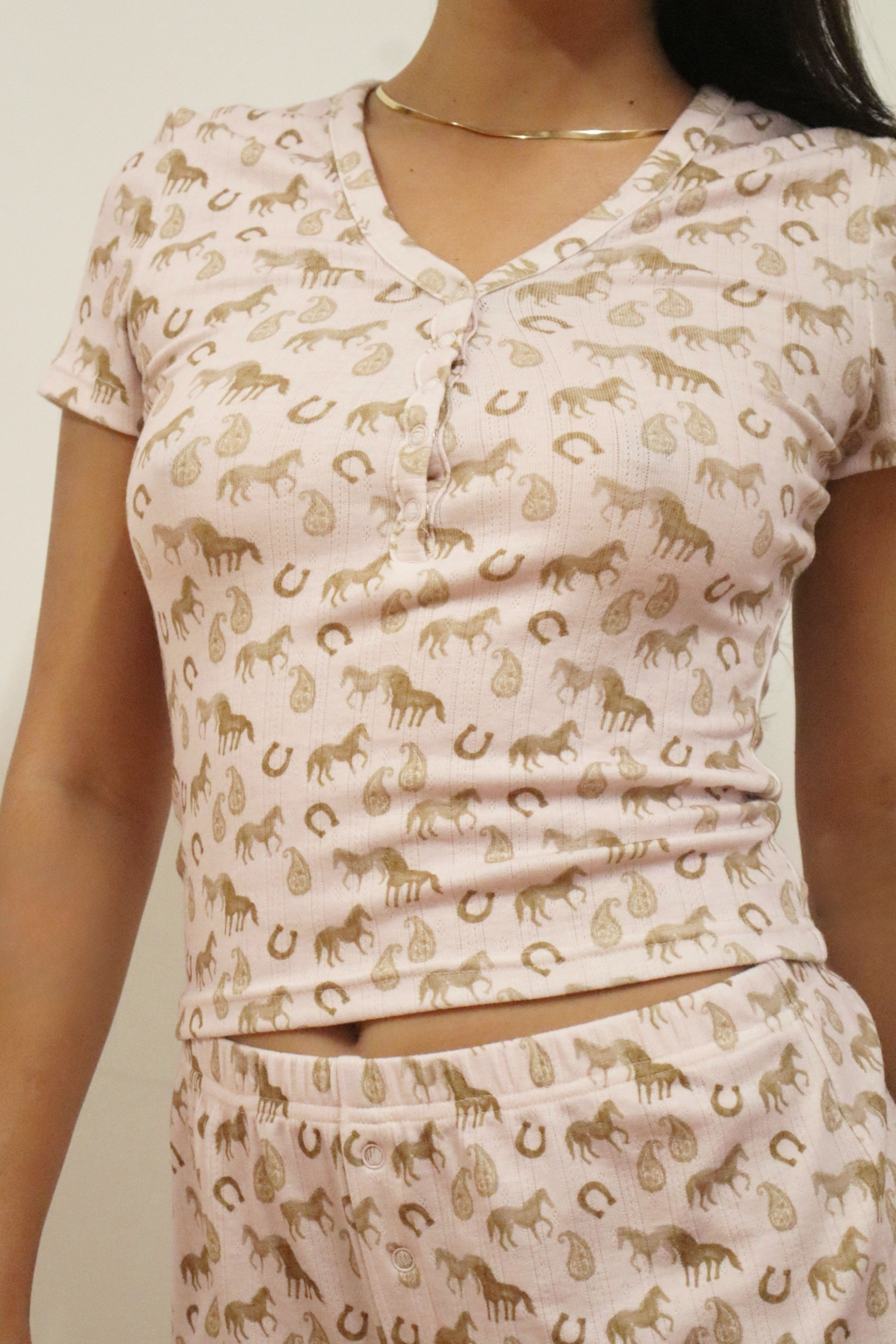 Lucky Charm long pajama set with whimsical horse print in pale lilac, featuring a Henley button top and elastic waist pants.