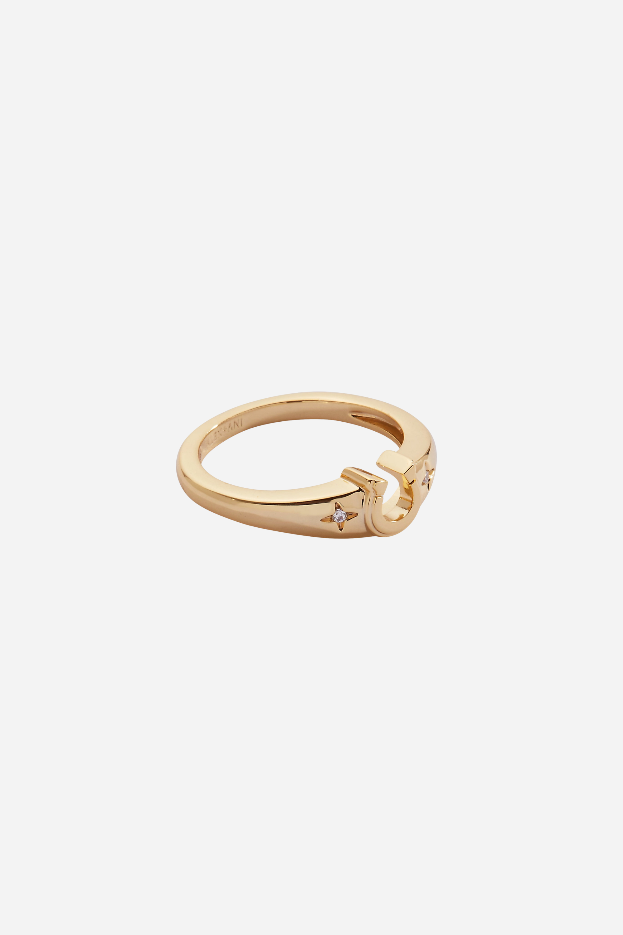 Gold-plated horseshoe signet ring featuring sparkling star-set crystal accents, designed as a lucky equestrian-inspired statement piece.