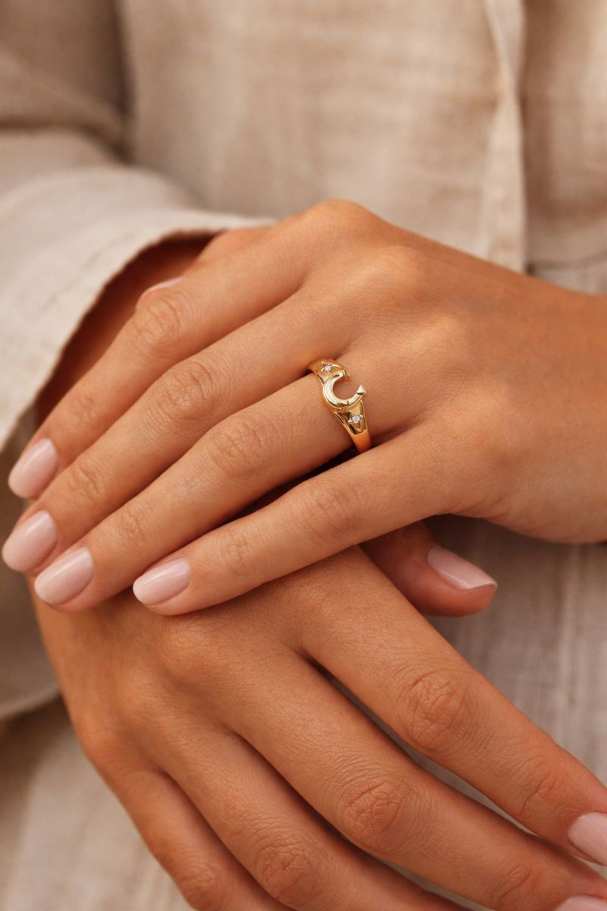 Gold-plated horseshoe signet ring featuring sparkling star-set crystal accents, designed as a lucky equestrian-inspired statement piece.
