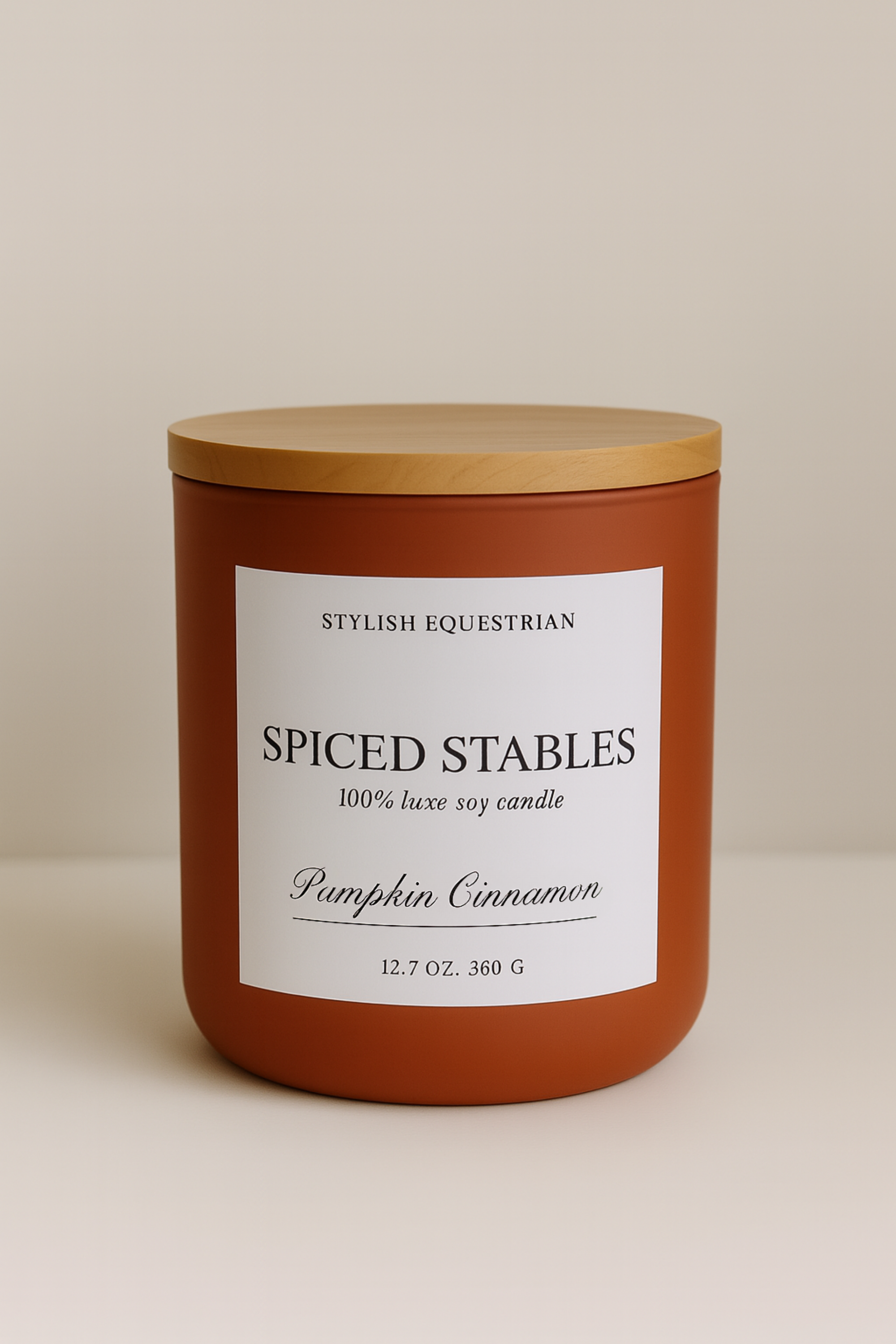 Luxe Signature Candle – Spiced Stables edition, a handmade 100% soy wax candle in a frosted matte glass vessel with wooden lid. Features a warm pumpkin cinnamon scent with notes of chai and vanilla—perfect for cozy autumn nights. Elegant equestrian-inspired home accent with 60+ hour burn time. Made in the USA. equestrian decor and home accents, horse themed candle, gifts for horse lovers, luxury soy candle, pumpkin cinnamon candle, Spiced Stables candle, fall equestrian home fragrance