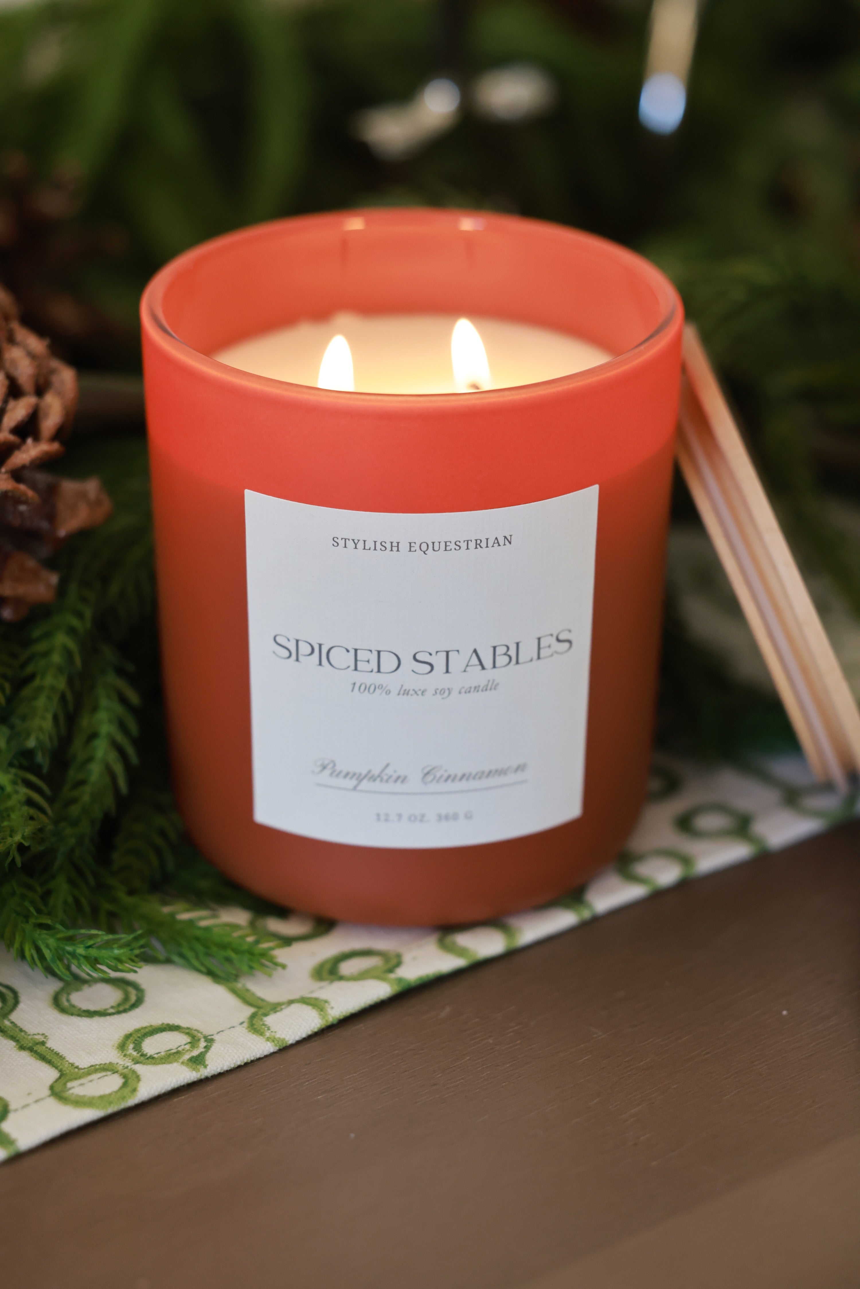 Luxe Signature Candle – Spiced Stables edition, a handmade 100% soy wax candle in a frosted matte glass vessel with wooden lid. Features a warm pumpkin cinnamon scent with notes of chai and vanilla—perfect for cozy autumn nights. Elegant equestrian-inspired home accent with 60+ hour burn time. Made in the USA. equestrian decor and home accents, horse themed candle, gifts for horse lovers, luxury soy candle, pumpkin cinnamon candle, Spiced Stables candle, fall equestrian home fragrance