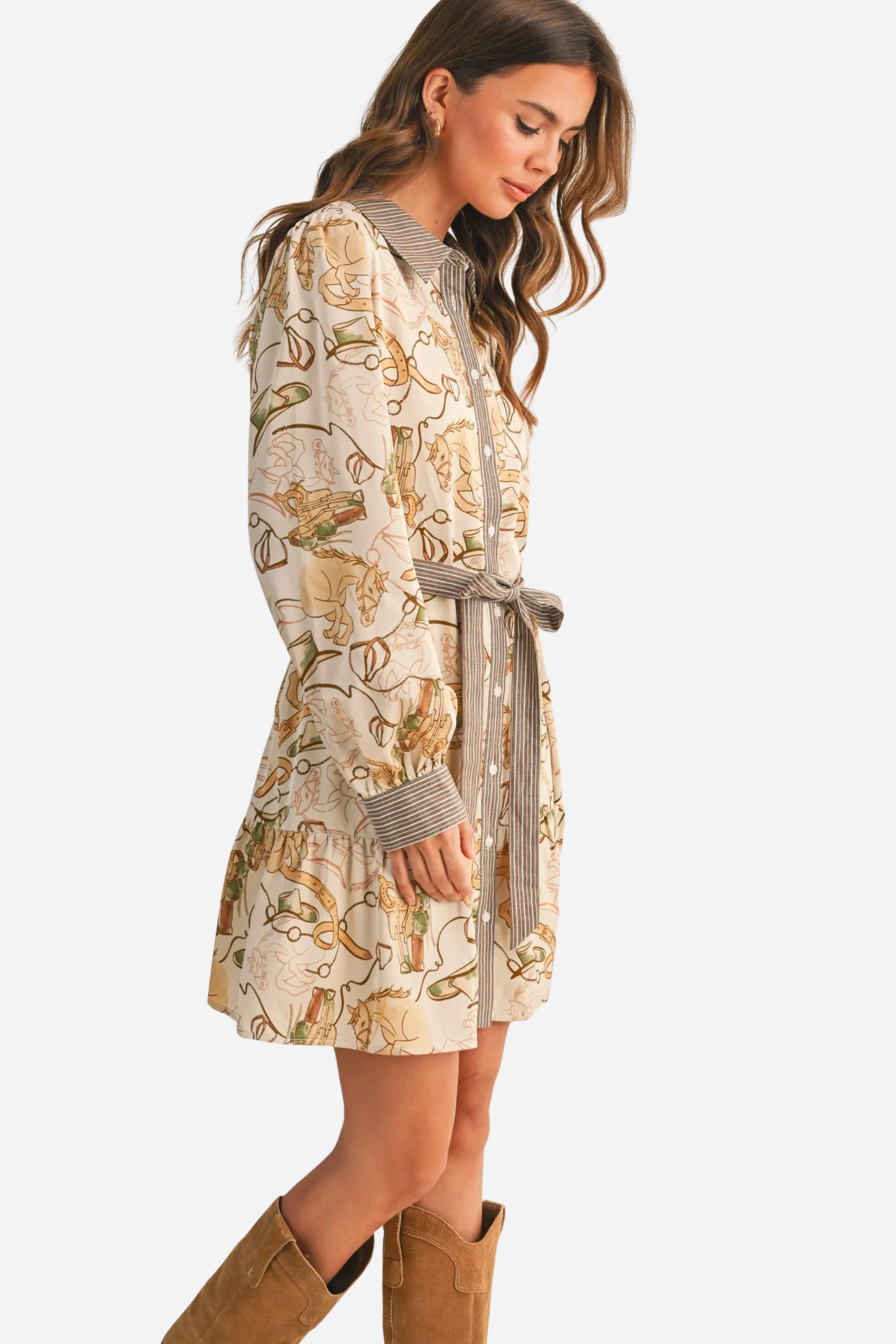 Woman wearing a patterned dress with a belt against a beige background - print mini dress, &merci exclusive, Cowgirl print dress, Equestrian-inspired dress, Fall rodeo outfit