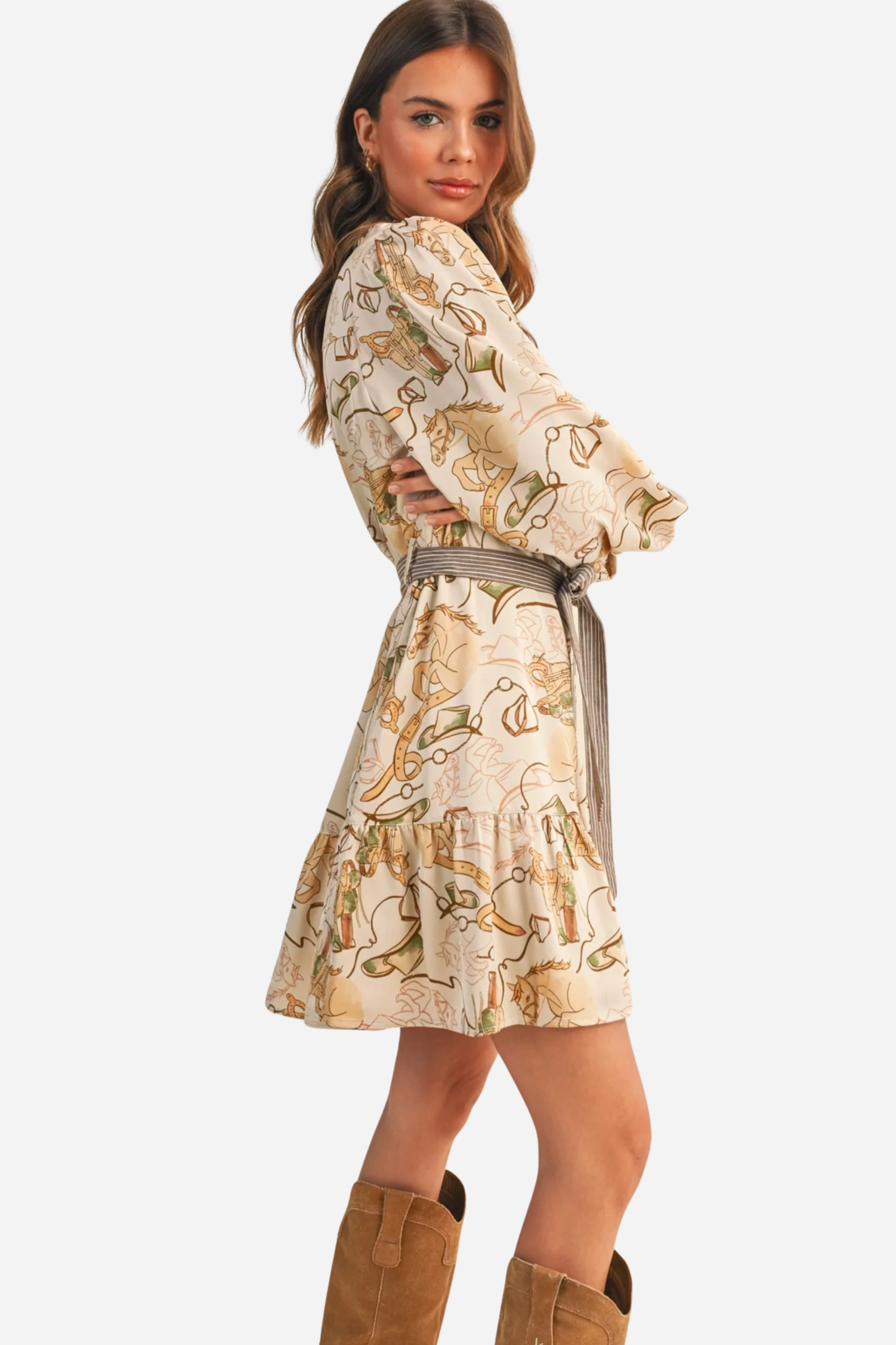 Woman wearing a patterned dress with a belt against a beige background - print mini dress, &merci exclusive, Cowgirl print dress, Equestrian-inspired dress, Fall rodeo outfit