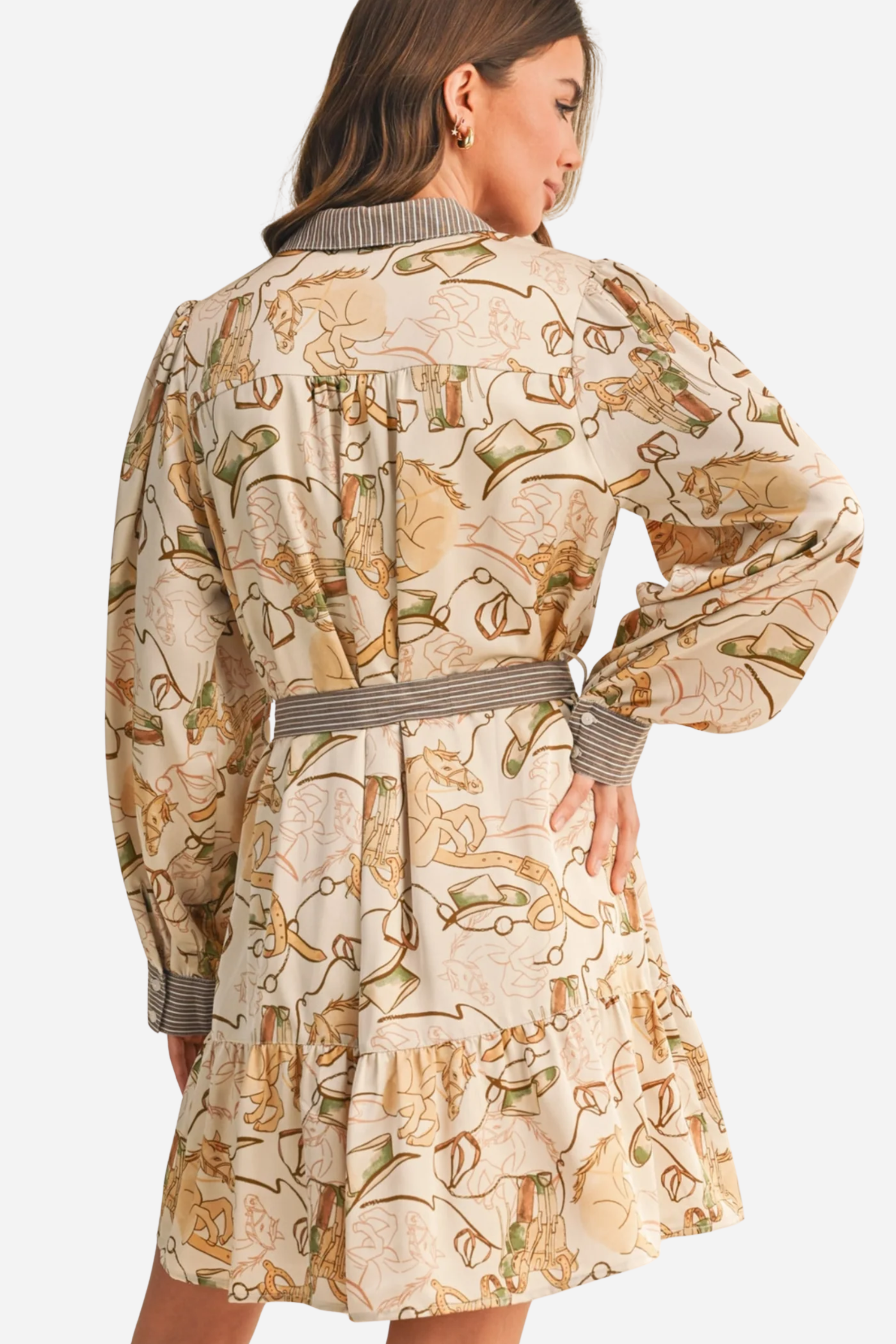 Woman wearing a patterned dress with a belt against a beige background - print mini dress, &merci exclusive, Cowgirl print dress, Equestrian-inspired dress, Fall rodeo outfit