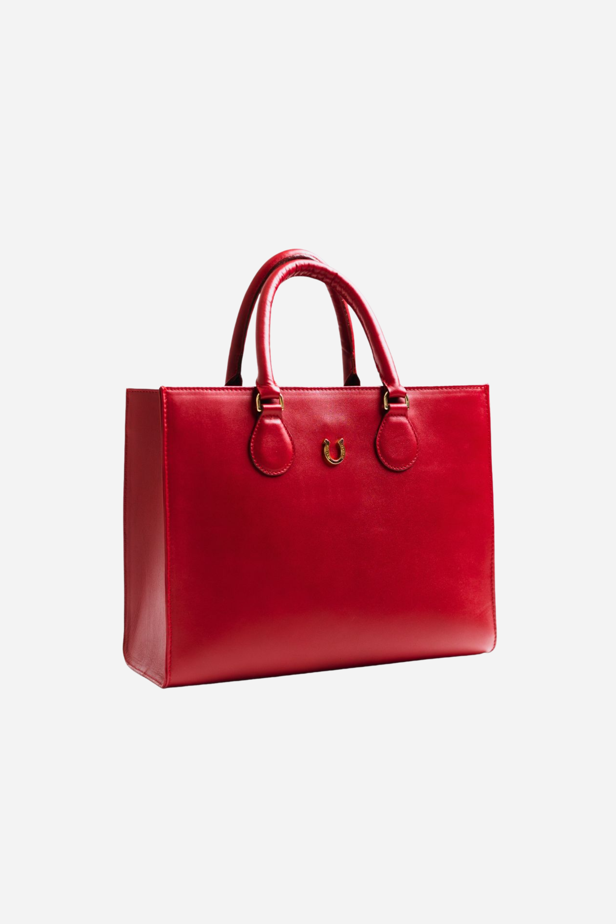 Spacious equestrian leather tote bag with a classic silhouette, gold hardware, interior compartments, and convertible top-handle or shoulder straps.