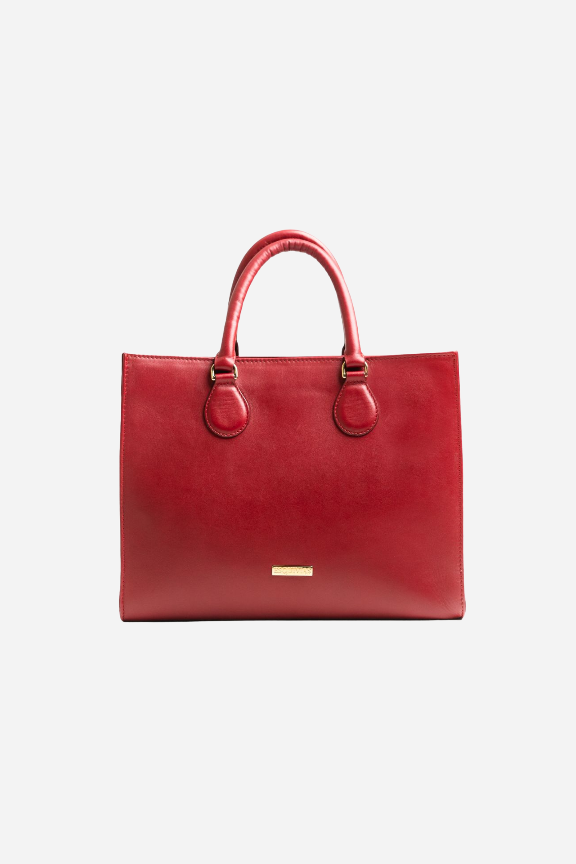 Spacious equestrian leather tote bag with a classic silhouette, gold hardware, interior compartments, and convertible top-handle or shoulder straps.