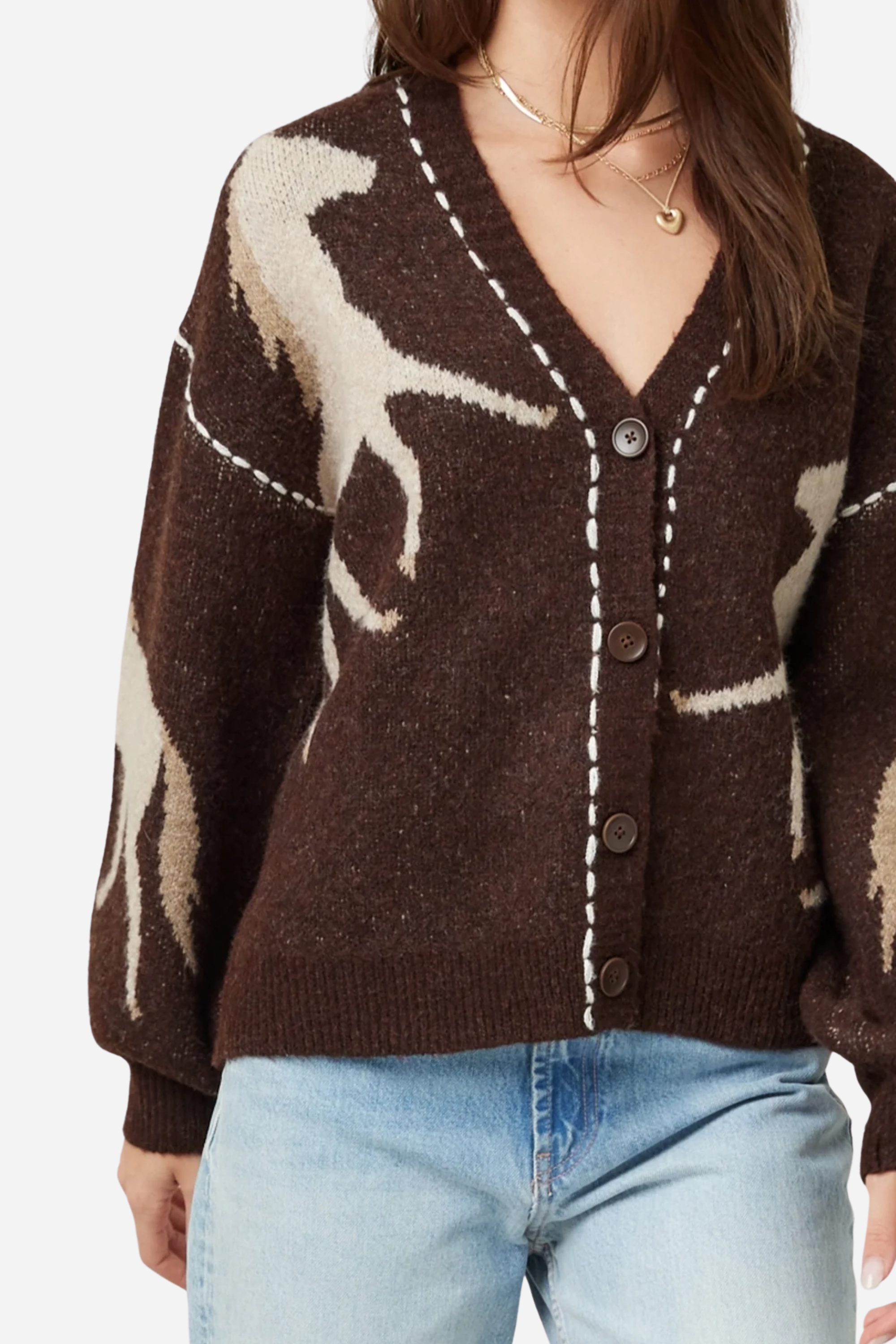 Woman wearing a brown cardigan with deer pattern and light blue jeans on a plain background - Horse knit cardigan, Brown western cardigan, Cowgirl graphic sweater, Oversized horse print cardigan, Equestrian boutique knitwear