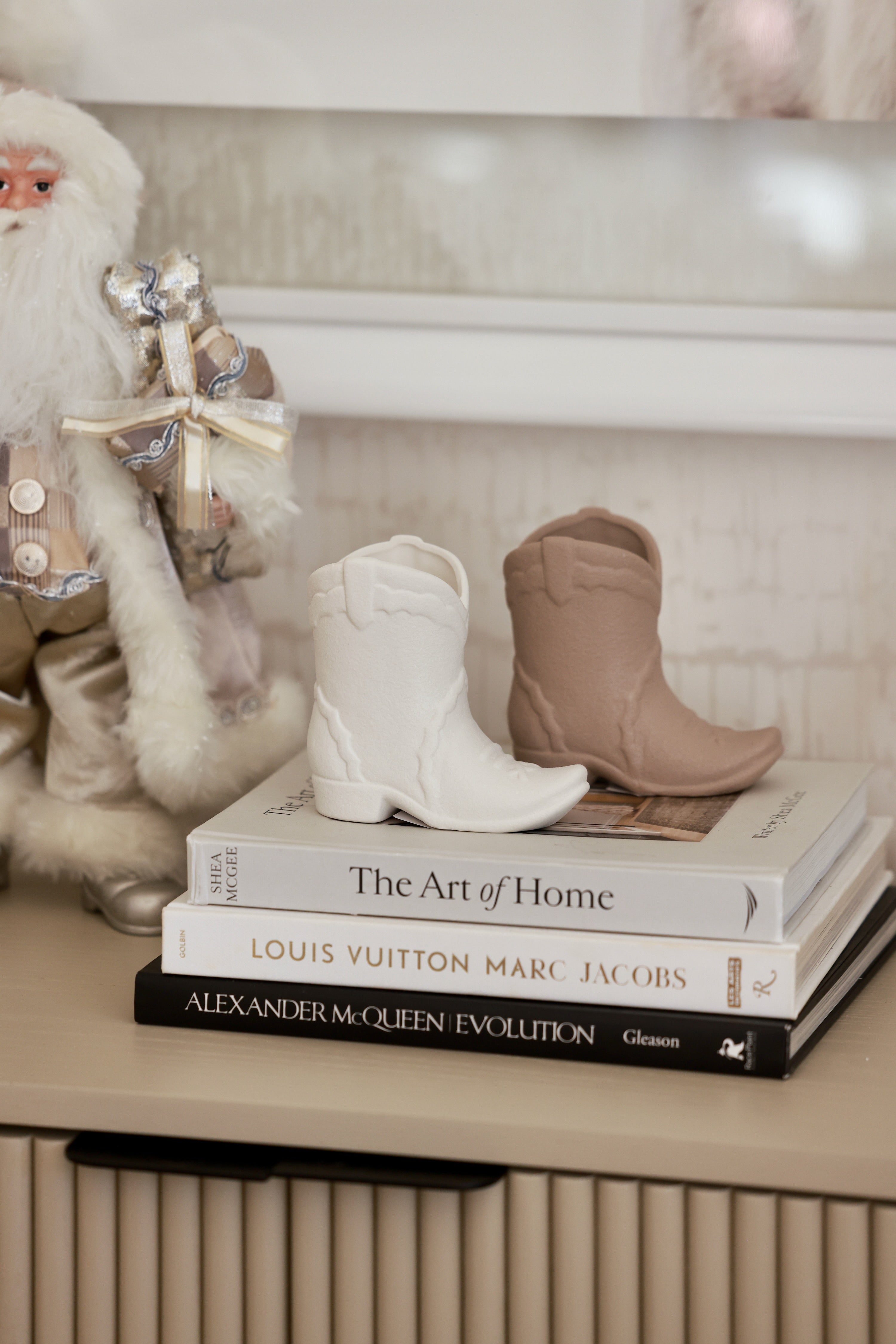 White ceramic cowboy boot candle with a warm smoked pistachio fragrance, blending vanilla, amber, and toasted spices. This chic western-inspired candle adds cozy cowgirl charm to equestrian home décor and can be reused as a decorative boot vase or keepsake after burning.