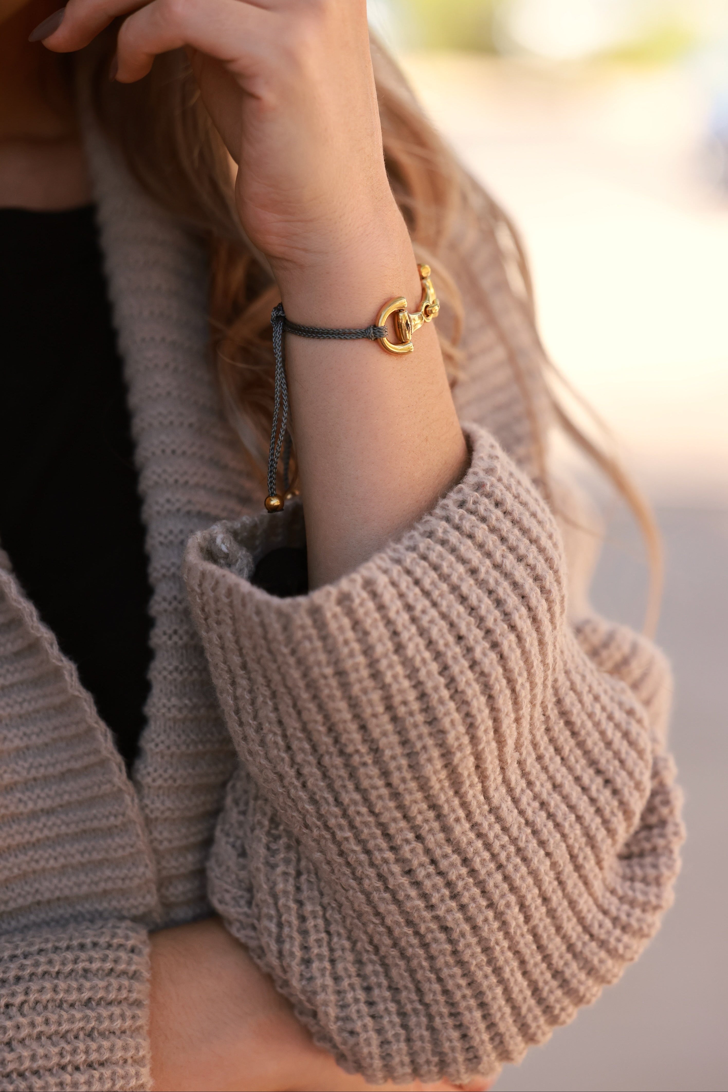 Grey Pony Bracelet from Stylish Equestrian x Dimacci, handmade in Germany with an adjustable nylon band and polished stainless steel snaffle bit detail. Elegant, dainty equestrian bracelet perfect for layering or gifting to horse lovers.