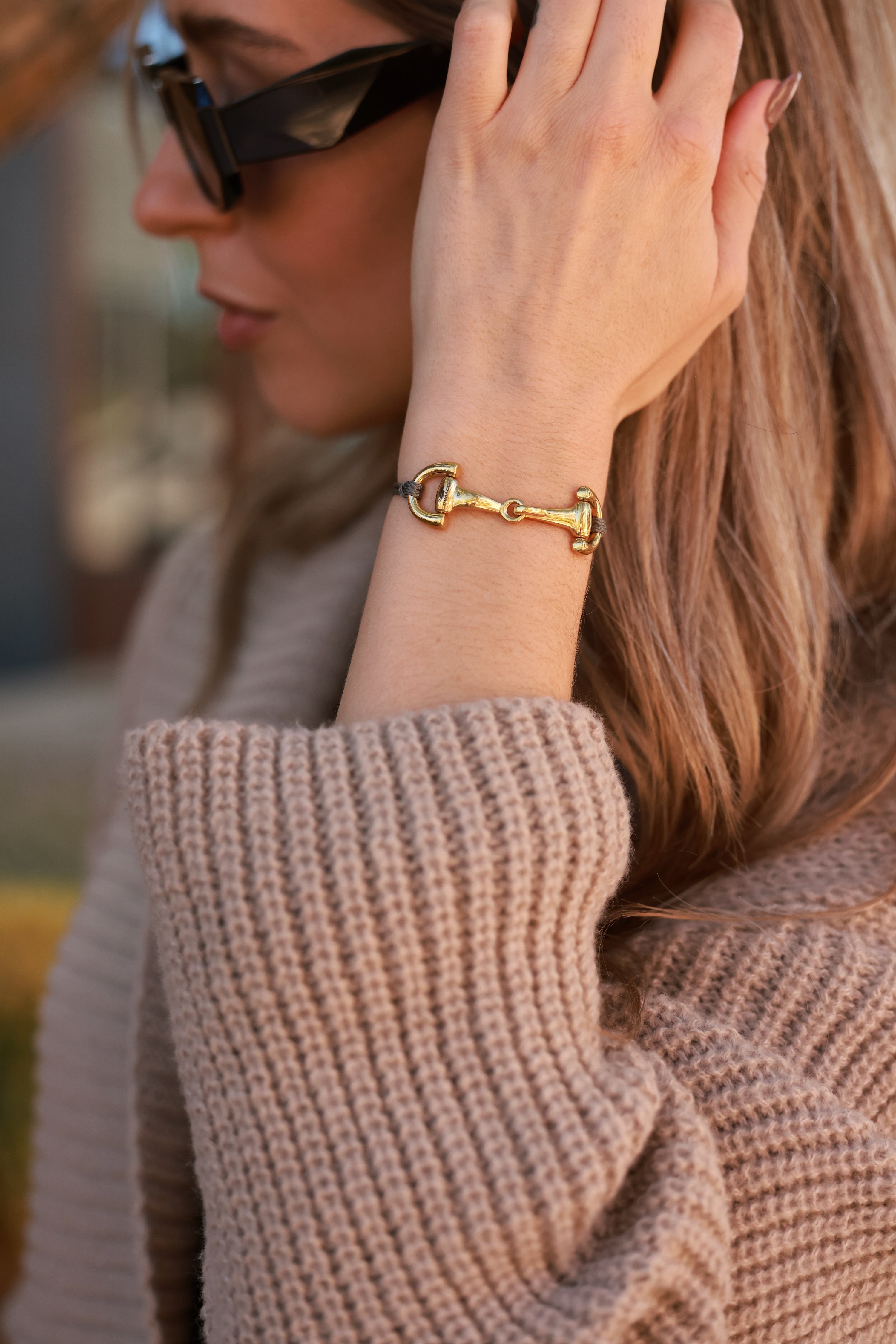 Grey Pony Bracelet from Stylish Equestrian x Dimacci, handmade in Germany with an adjustable nylon band and polished stainless steel snaffle bit detail. Elegant, dainty equestrian bracelet perfect for layering or gifting to horse lovers.