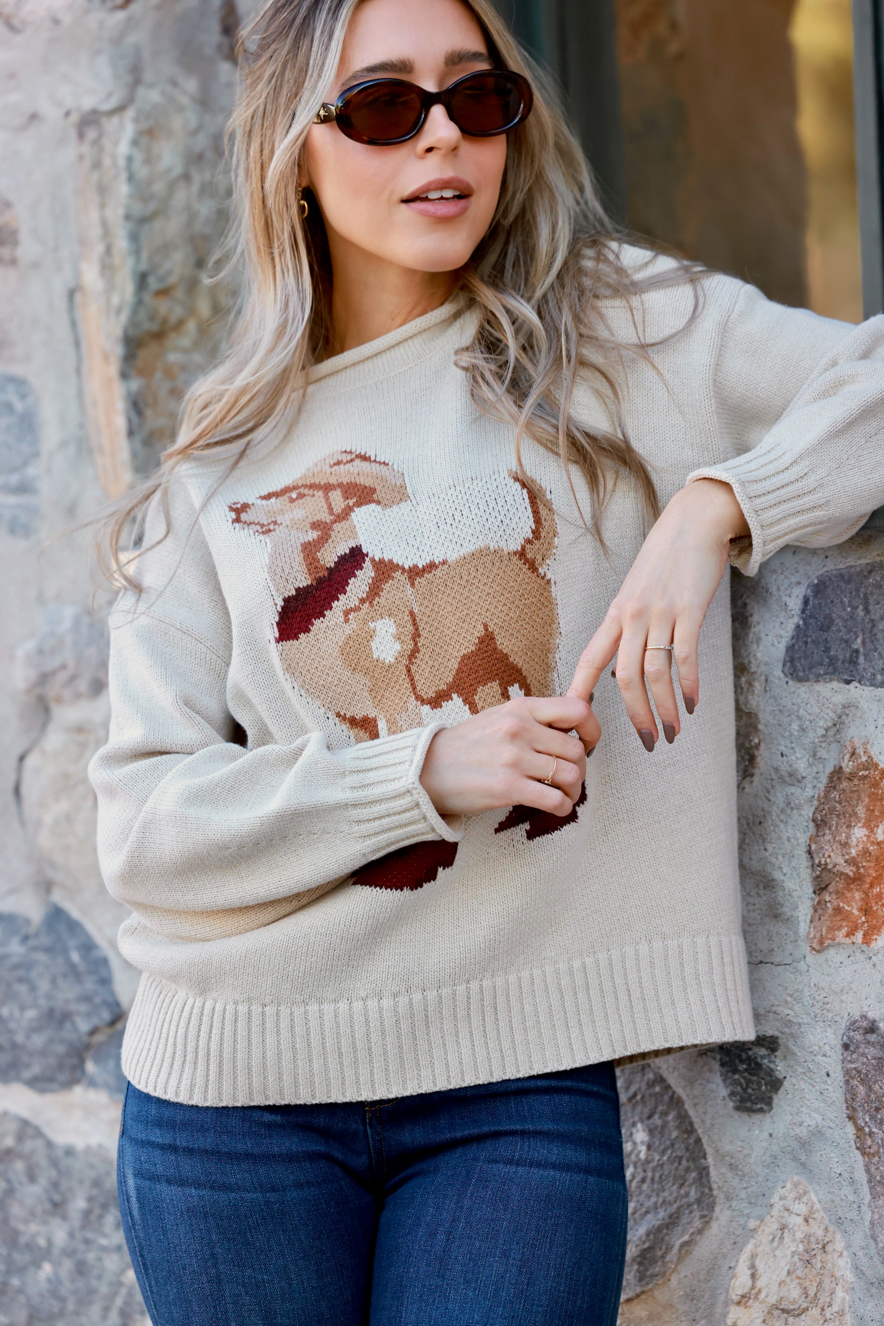 A cozy Ralph Western Sweater featuring a playful knit dog wearing a cowboy hat, boots, and scarf. The pullover has a relaxed fit with ribbed hems and cuffs, a mock neck, and a soft cotton-acrylic knit. Shown in heather grey or rust, styled casually with jeans. WESTERN DOG MOTIF PULLOVER SWEATER - WESTERN COWYBOY GRAPHIC, ANIMAL, DOG, LOOSE AND COMFORTABLE