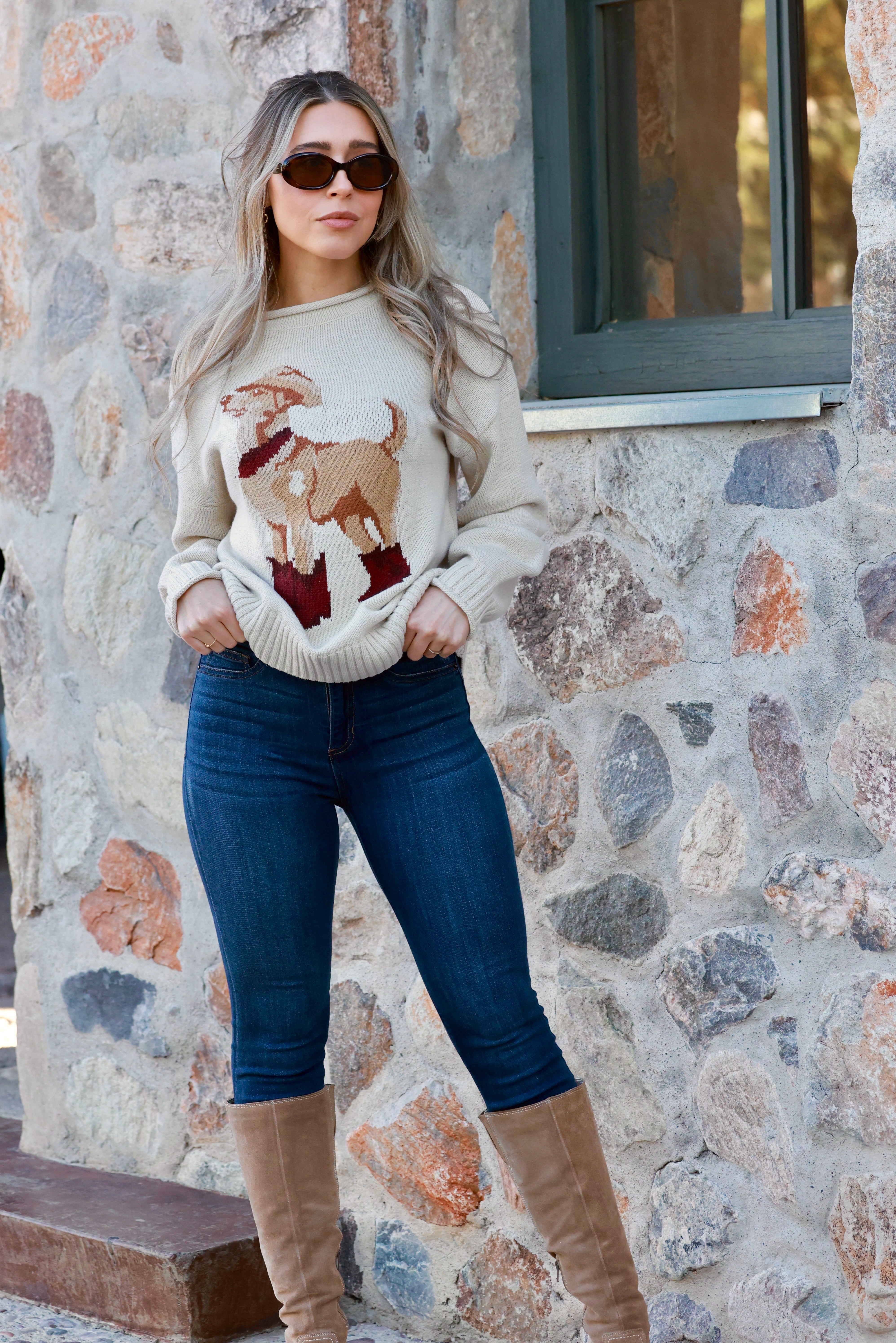 A cozy Ralph Western Sweater featuring a playful knit dog wearing a cowboy hat, boots, and scarf. The pullover has a relaxed fit with ribbed hems and cuffs, a mock neck, and a soft cotton-acrylic knit. Shown in heather grey or rust, styled casually with jeans. WESTERN DOG MOTIF PULLOVER SWEATER - WESTERN COWYBOY GRAPHIC, ANIMAL, DOG, LOOSE AND COMFORTABLE