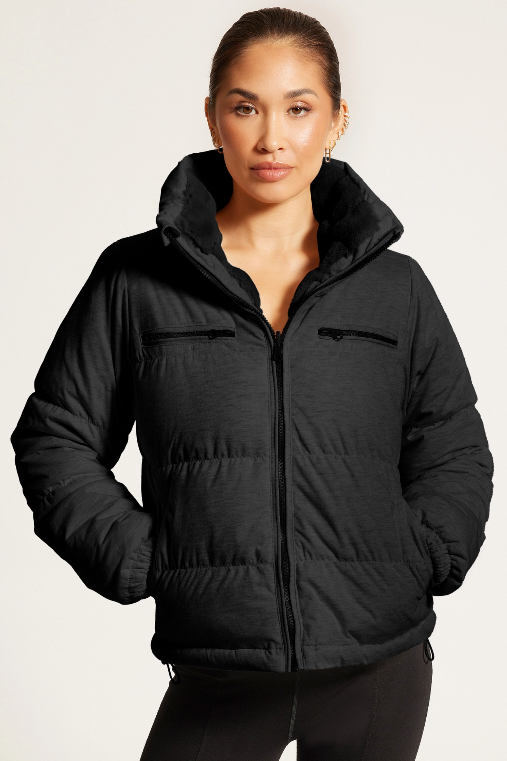 Reversible puffer jacket, Faux fur lined coat, Winter adventure jacket, Black insulated puffer, Stylish outdoor layer Black Reversible Puffer Jacket featuring a sleek exterior and ultra-soft faux fur interior for versatile styling. Down-filled for warmth with adjustable drawstring waist, hidden hood, and thumbholes for comfort. A stylish, adventure-ready equestrian-inspired winter coat perfect from trails to town.