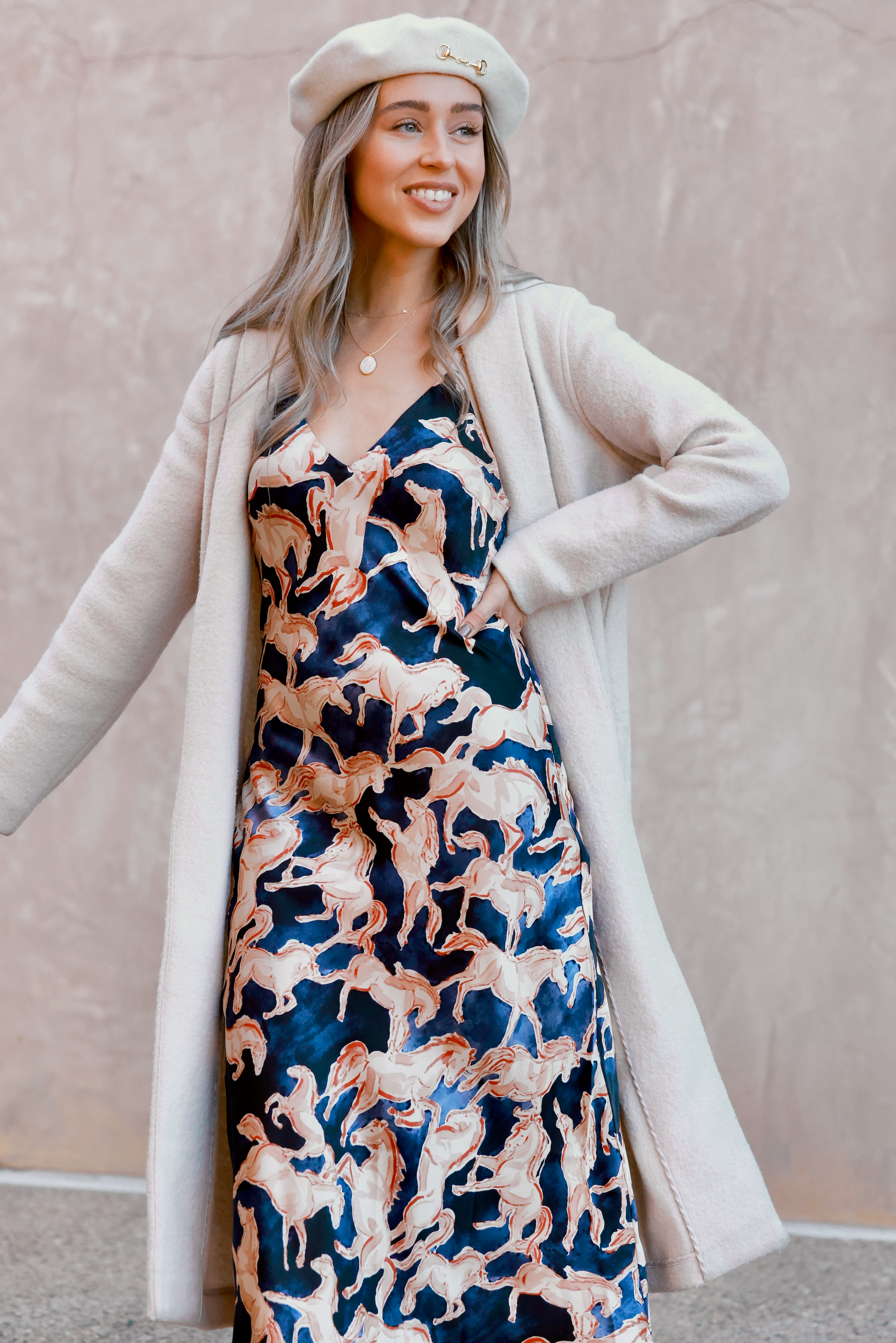 Woman wearing a dress with horse pattern against a neutral background - Western slip dress, Horse print satin dress, Bias cut midi dress, Navy equestrian dress, Vintage-inspired slip dress, Cocktail party dress, Day party outfit, Western navy satin dress, Women’s equestrian fashion, Retro western slip dress