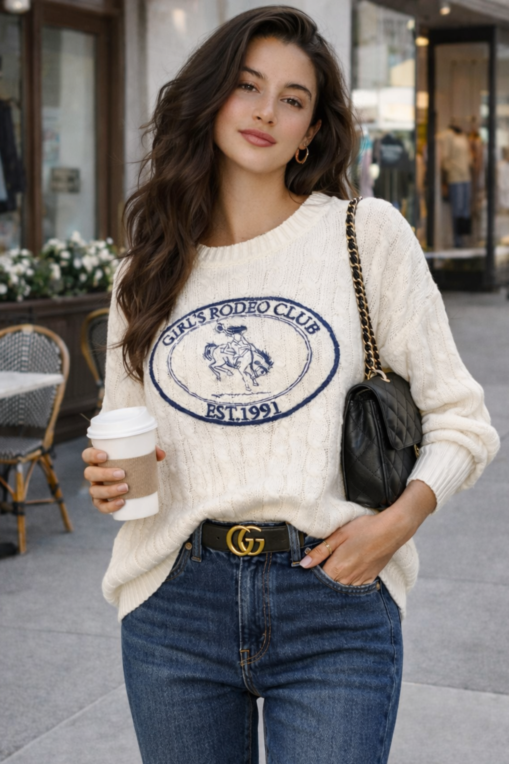 The Girls Rodeo Club Sweater blends classic varsity style with timeless equestrian charm. Designed with a relaxed dropped-shoulder silhouette and finished with textured cable-knit detailing, this cozy knit delivers effortless western sophistication, whether you're at the barn, in town, or layered for cool spring rides. Featuring navy embroidered varsity lettering across a soft cream knit, this sweater captures the spirit of rodeo heritage with a modern cowgirl feel.